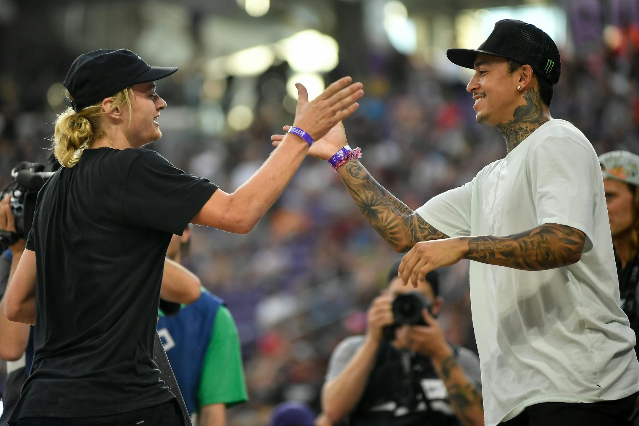 Alex Majerus high fived Nyjah Huston after Majerus' third run in the X Games skateboarding street contest. Majerus and Huston placed second and third in the event respectively.