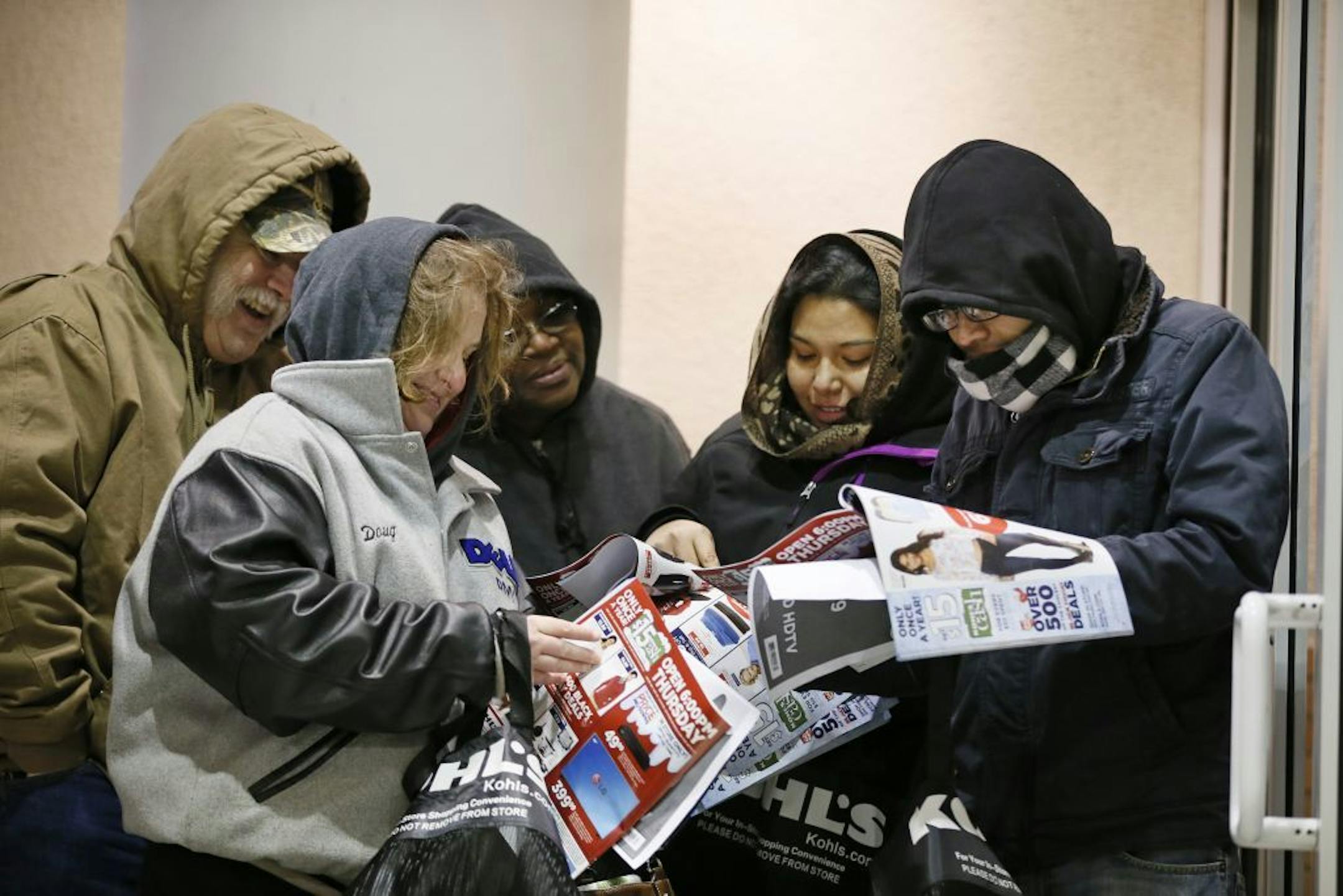 Black Friday shoppers looked at sale items while they waited for Kohls to open Thursday November 27, 2014 in Bloomington, MN.
