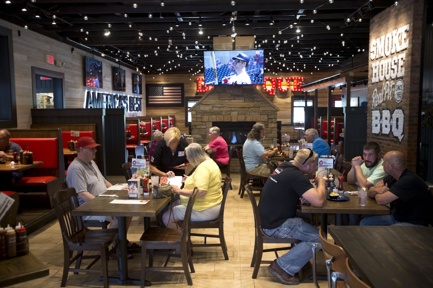 Lunch patrons sit in the main dining room at Famous Dave's in Coon Rapids to enjoy a meal off their new menu.