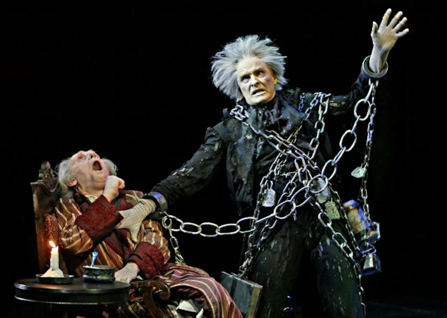 PHOTO � Michal Daniel, 2007: Nathaniel Fuller (Jacob Marley) and Raye Birk (Ebenezer Scrooge) in the Guthrie Theater production of A CHRISTMAS CAROL by Charles Dickens, adapted by Barbara Field, directed by Gary Gisselman, set design by Neil Patel, original costumes by Jess Goldstein, additional costumes by David Kay Mickelsen, lighting design by Marcus Dilliard. November 20 - December 30, 2007.