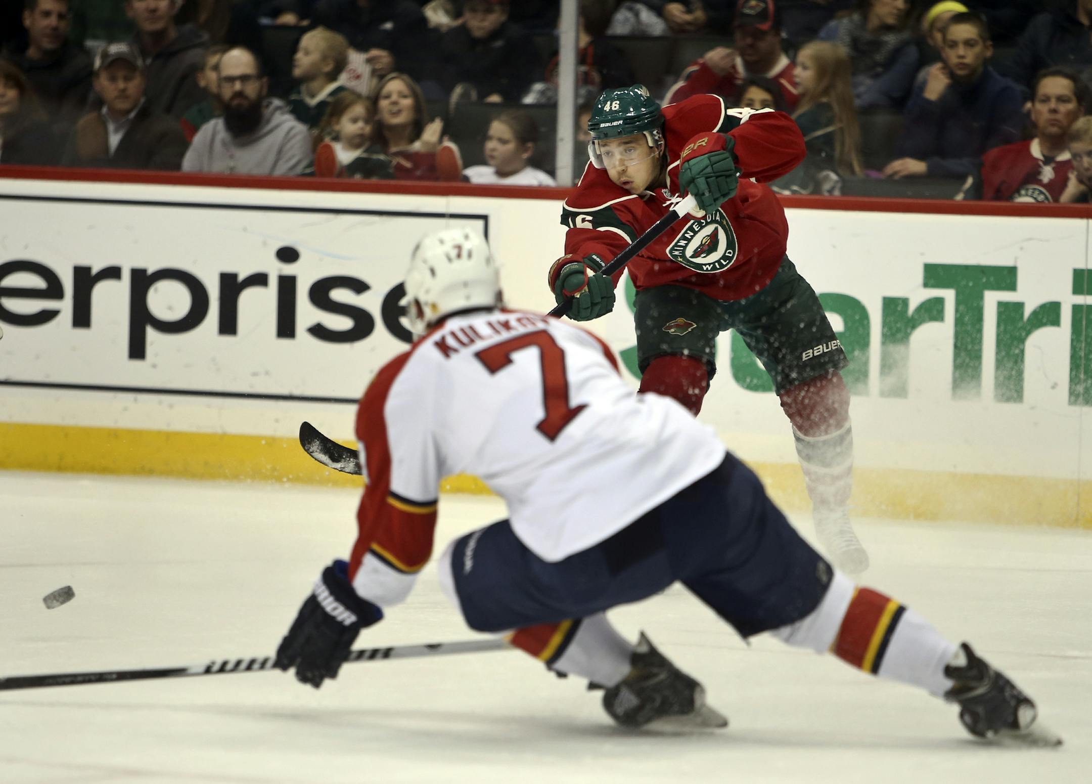 During the first period, Florida's Dmitry Kulikov (7) tries to defend a centering shot by the Wild's Jared Spurgeon at Xcel Energy Center Friday, Nov. 15, 2013, in St. Paul