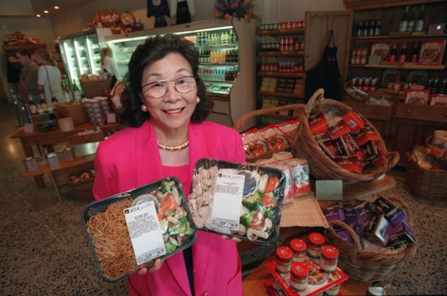 Leeann Chin held prepackaged stirfry foods available in the marketplace at the Asia Grille in Eden Prairie.