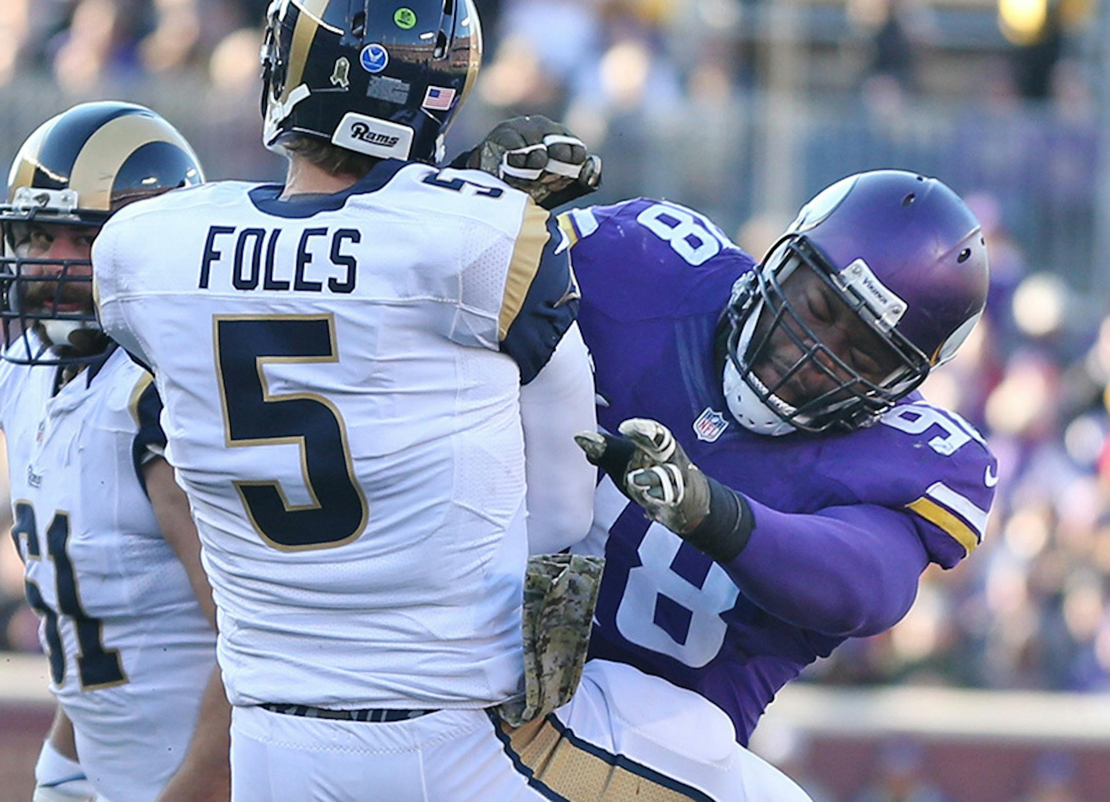 Minnesota Vikings defensive tackle Linval Joseph (98) pressed St. Louis Rams quarterback Nick Foles (5) into throw an incomplete pass in the third quarter Sunday November 8, 2015 in Minneapolis, MN.
