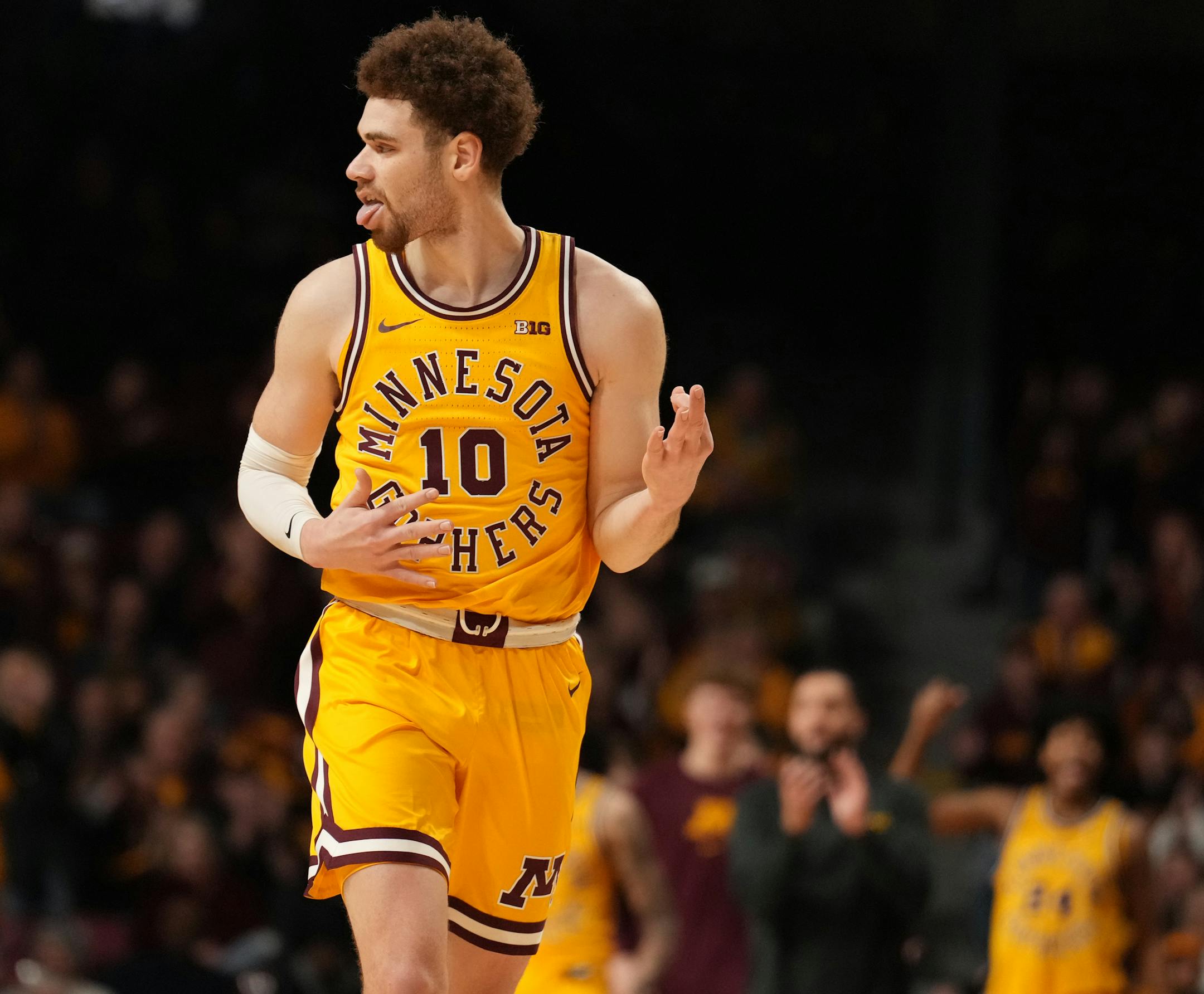 Minnesota Golden Gophers forward Jamison Battle (10) reacts after hitting a three-point shot in the second half.