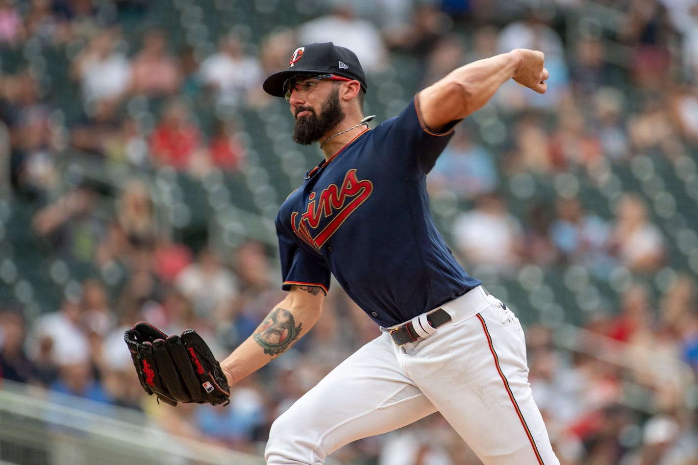 Minnesota Twins pitcher Devin Smeltzer throws to a Chicago White Sox batter during the first inning of a baseball game Friday, July 15, 2022, in Minneapolis. (AP Photo/Craig Lassig)