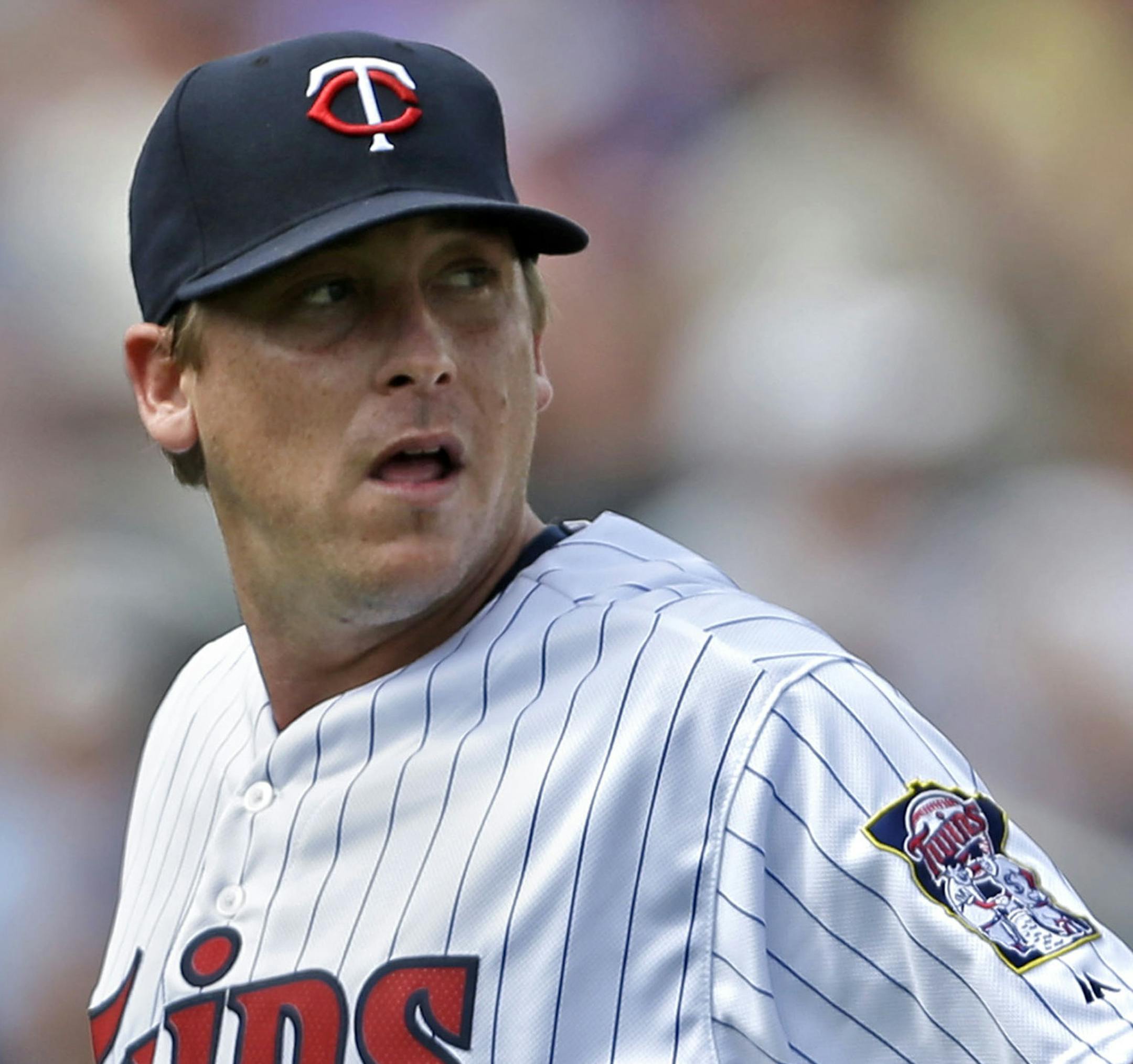 Minnesota Twins starting pitcher Kevin Correia (30) reacts after giving up a two-run homer to Pittsburgh Pirates third baseman Pedro Alvarez during the third inning of an exhibition baseball game, Wednesday, March 12, 2014, in Fort Myers, Fla. (AP Photo/Gerald Herbert)
