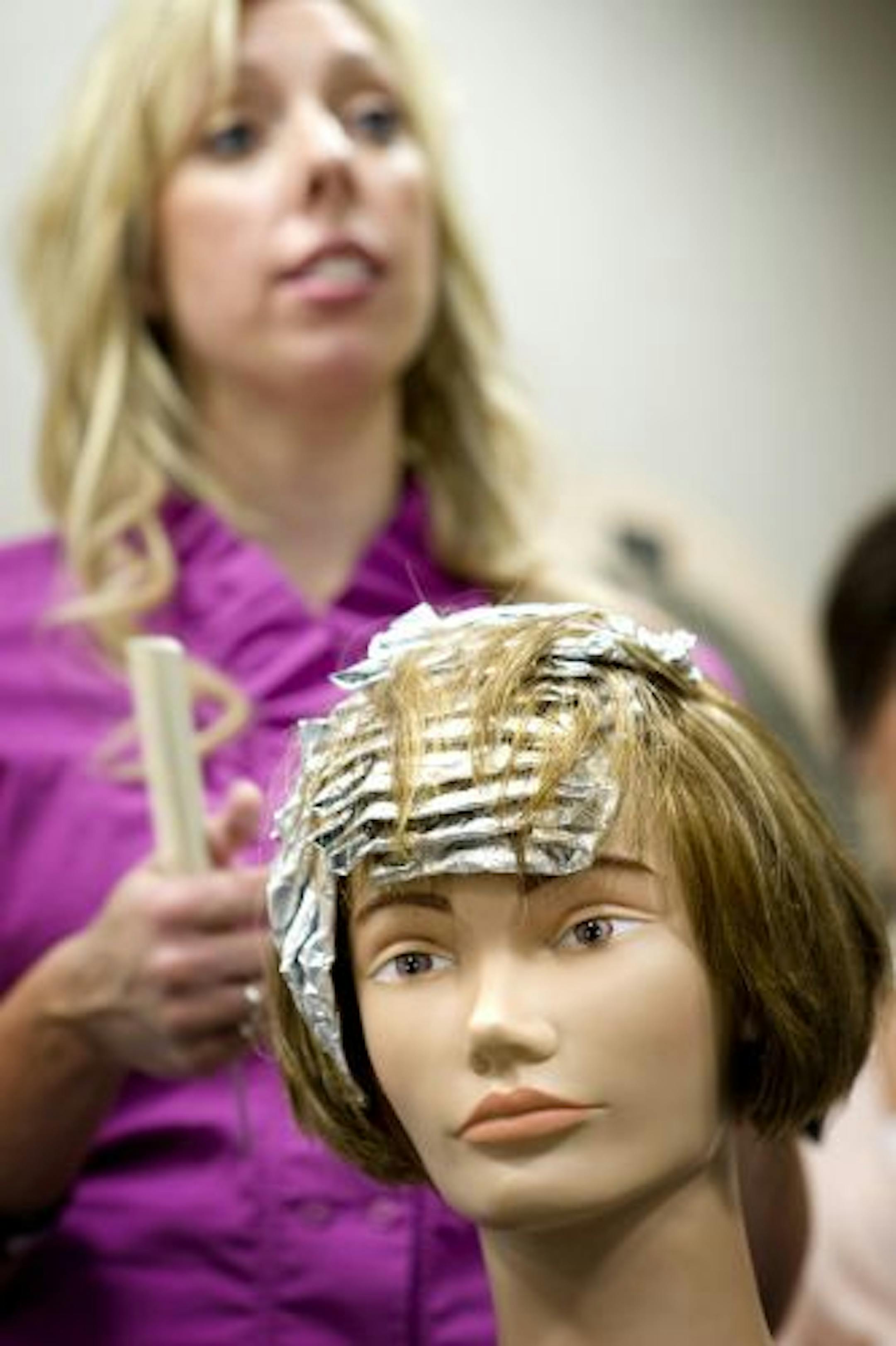 Cole's stylist Jen Strean demonstrated foiling techniques in the Burnsville Cole's Salon. Ongoing training is an integral part of working at Cole's.