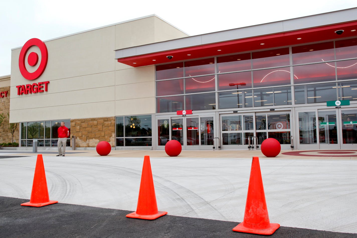 A Target employee waits to greet attendees for the Target Corp. annual shareholders meeting in Waukesha, Wisconsin, U.S., on Thursday, May 28, 2009. Target Corp. shareholders re-elected the retailer's existing directors, rejecting a slate nominated by William "Bill" Ackman, founder of Pershing Square Capital Management and one of Target's largest shareholders, after two months marked by dueling claims. Photographer: Jonathan Kirn/Bloomberg News