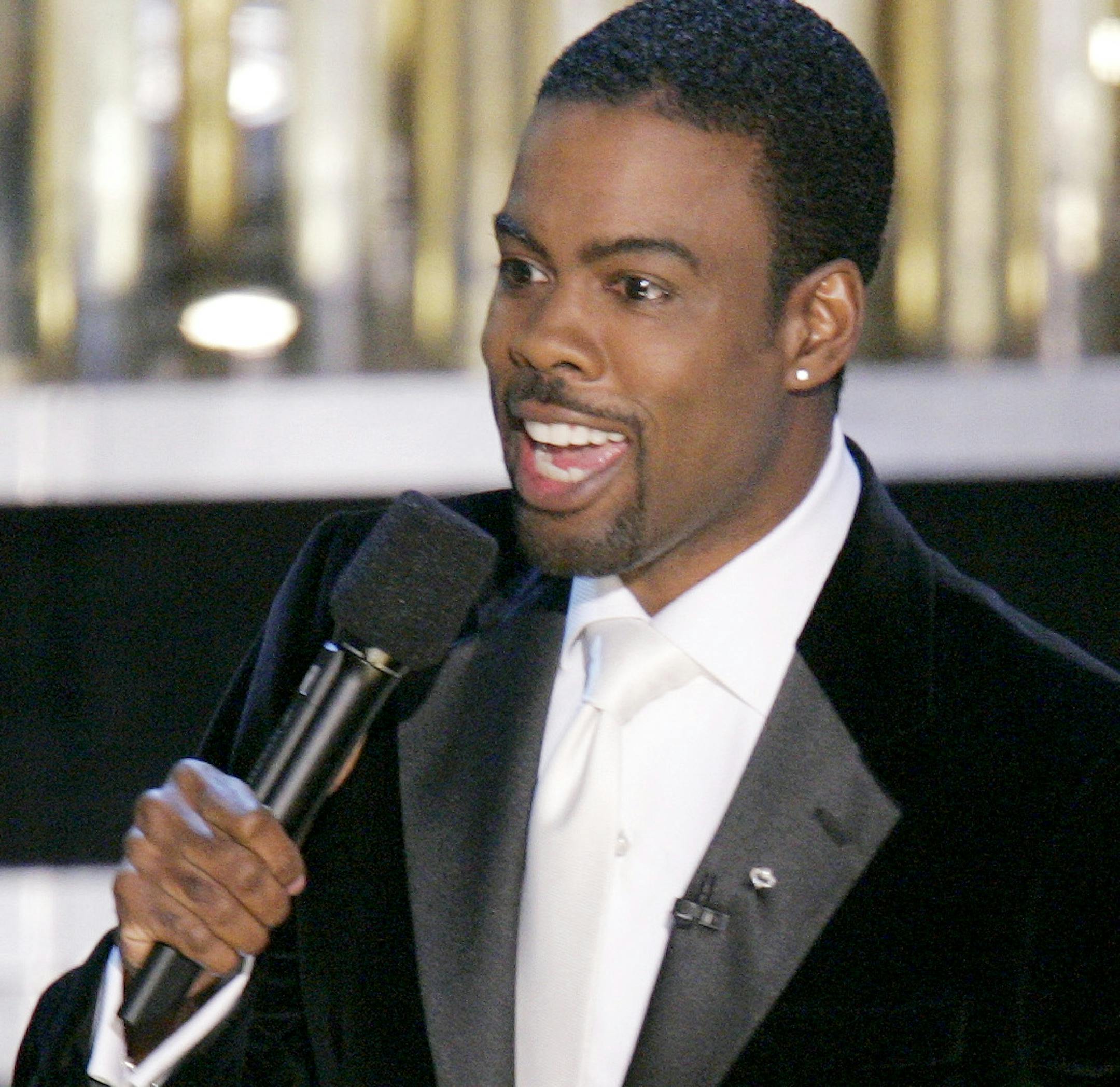 FILE - In this Feb. 27, 2005 file photo, Chris Rock hosts the 77th Academy Awards telecast in Los Angeles. Rock will return to host the Oscars for a second time. The showís producers say the prolific comedian-filmmaker will be at the helm for the 88th Academy Awards next February 28. (AP Photo/Mark J. Terrill, File)