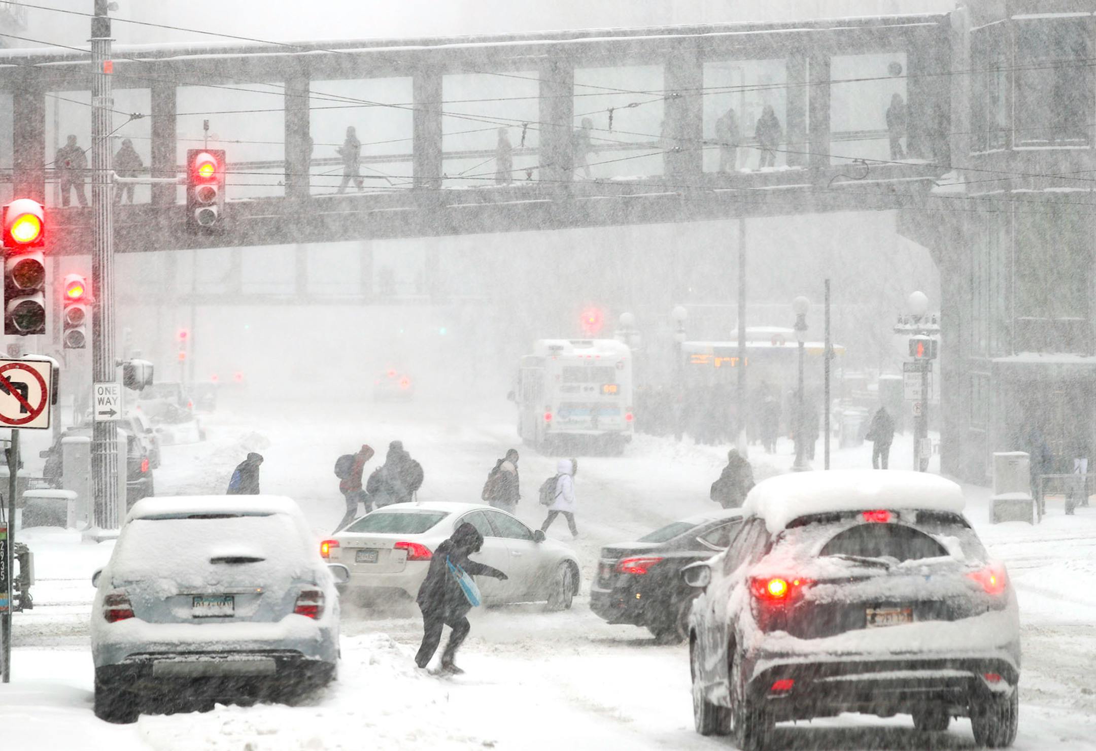 As the snow piled up in downtown St. Paul, commuters scrambled to navigate to safety before being stuck in the city. 5th Street and Cedar.