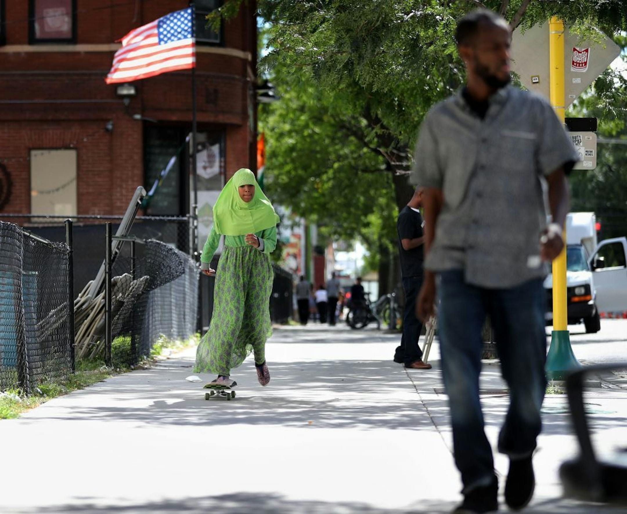 The Cedar-Riverside neighborhood along Cedar Avenue, known to some as "Little Mogadishu, " is home to many Somali immigrants and youth, as well as other East African immigrants. Here, while waiting for the festival to fire up, Fadumo Ahmed, 11, of Minneapolis skateboarded along the closed Cedar Ave. S. during the First Annual West Bank Block Party Saturday, Sept. 10, 2016, in Minneapolis, MN.