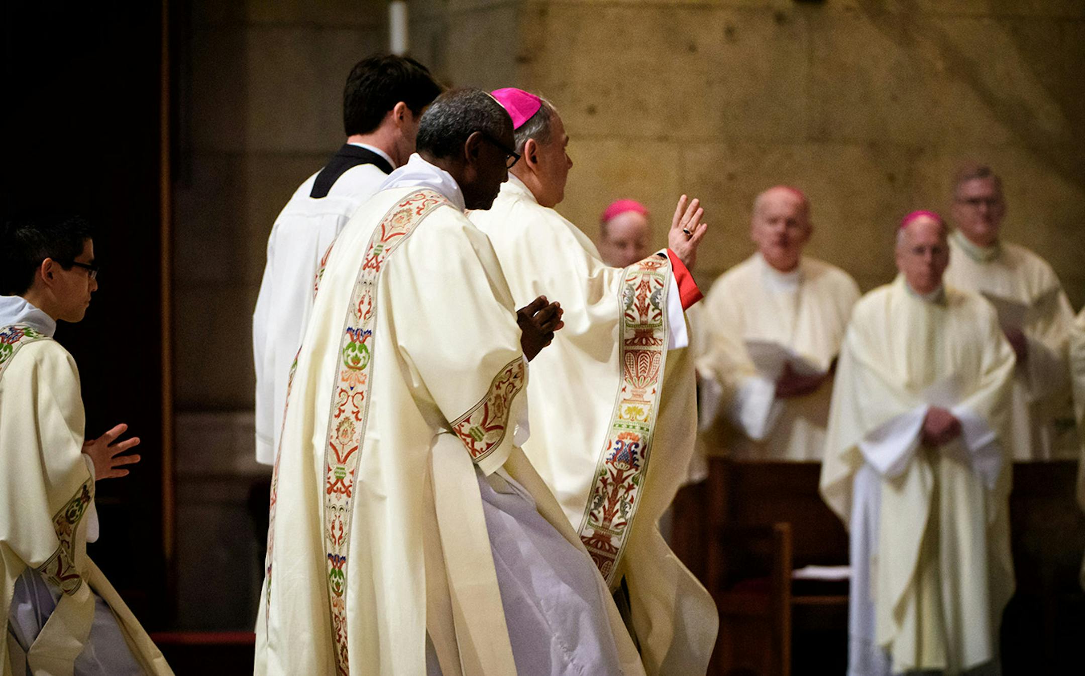 Archbishop Bernard Hebda greeted bishops and priests at the altar.