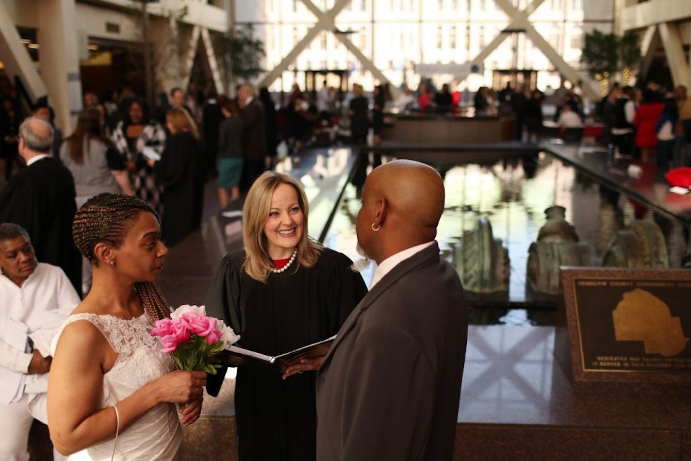 Judge Lois Conroy smiled as she presided over the wedding ceremony of Yvette and Michael Harris on Valentine's Day at the Government Center.