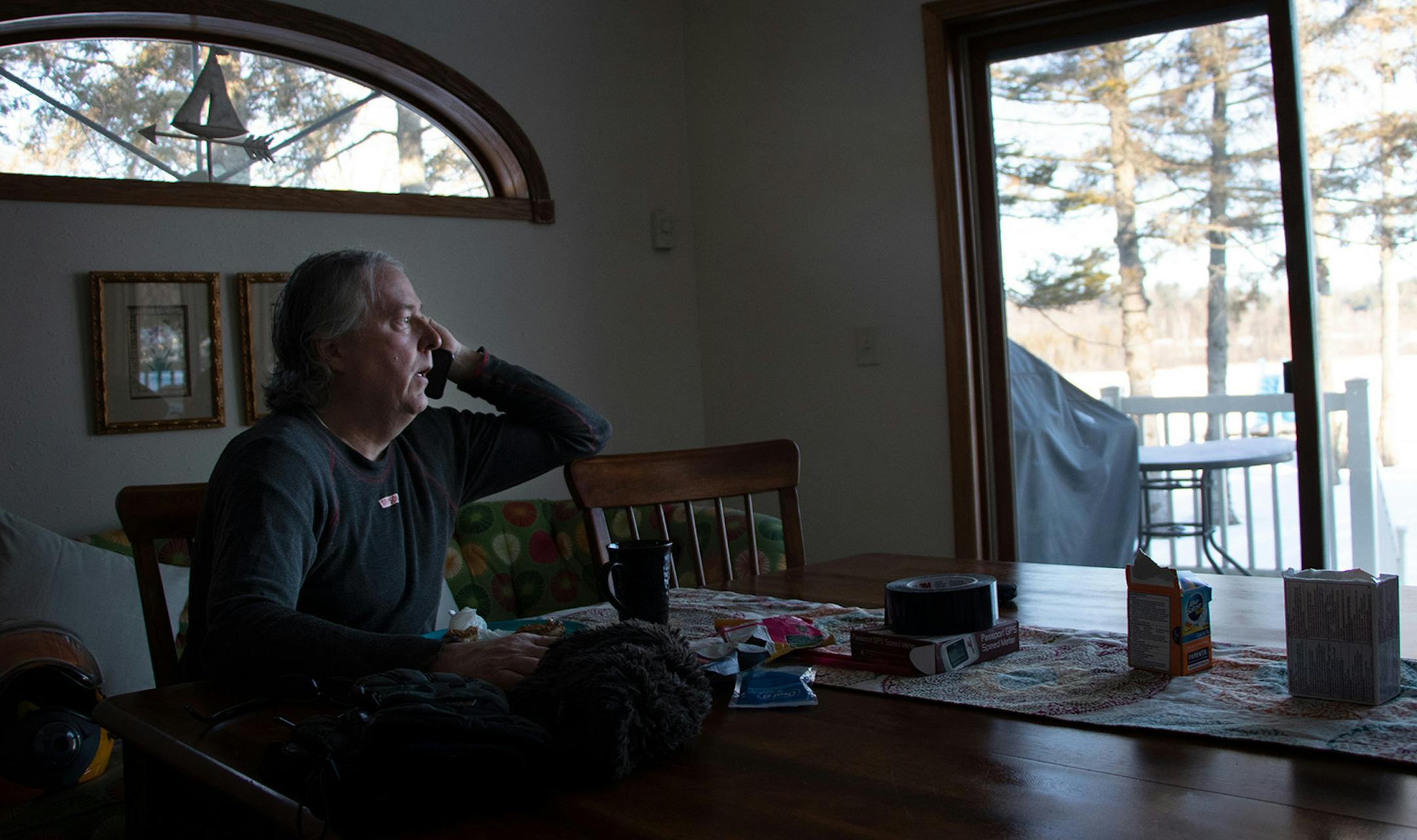 Kurt Anderson recieves a weather update before the Rocketboys team gathers on the morning of the Arctic Arrow�s launch, Sunday, Feb. 16, 2020 on Bear Lake in Manawa, WI.