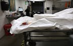 A body is processed at the Pierce County Medical Examiner's office in Tacoma, Washington.