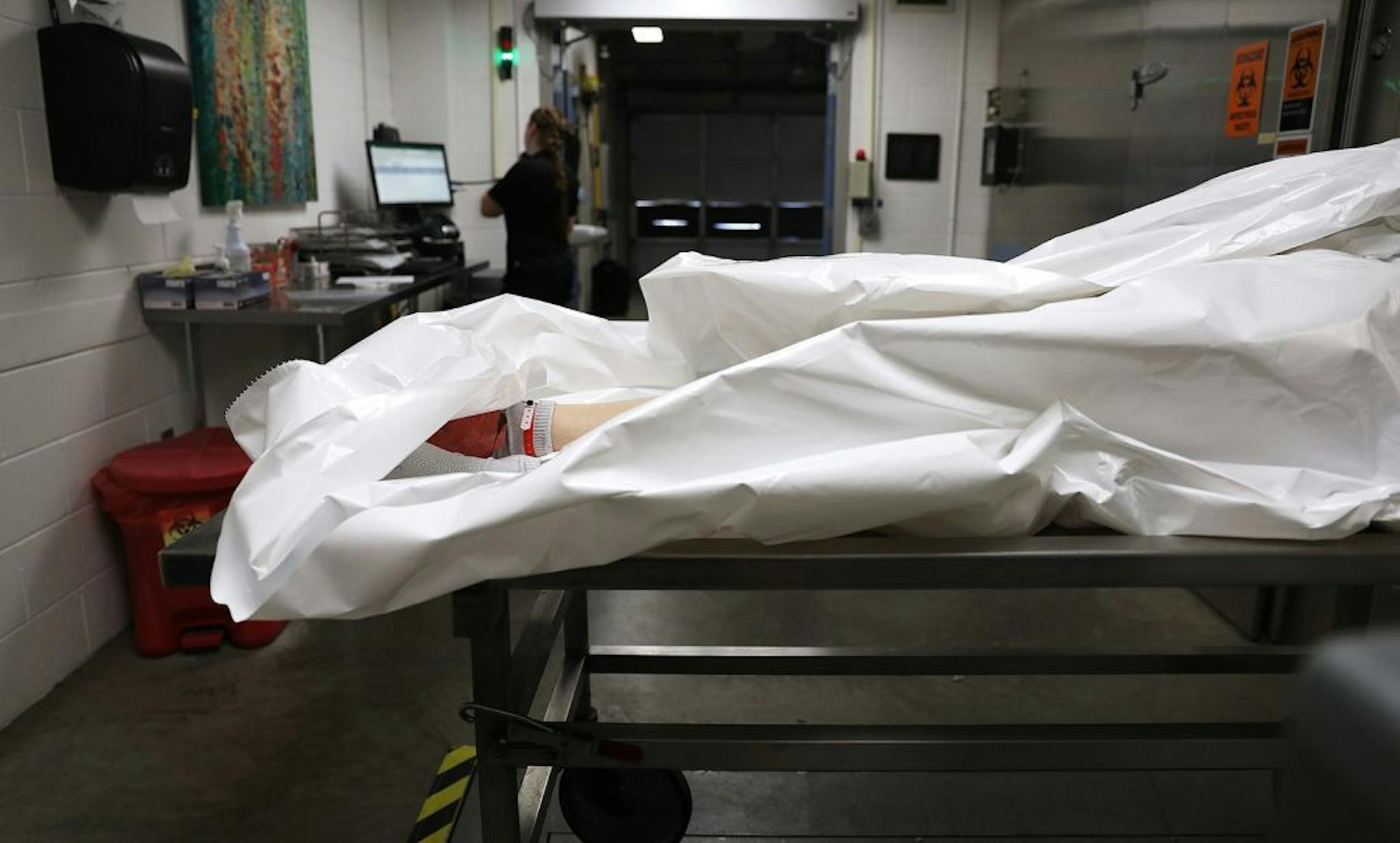 A body is processed at the Pierce County Medical Examiner's office in Tacoma, Washington.