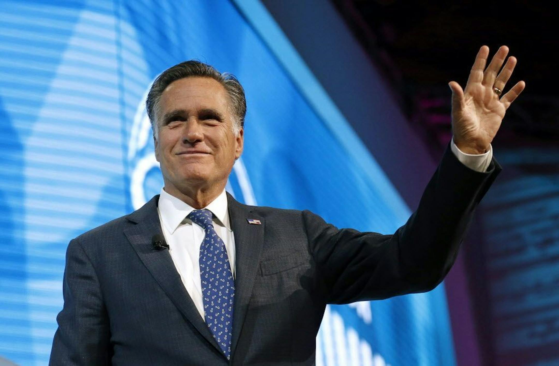 FILE - In this Jan. 19, 2018,, file photo, former Republican presidential candidate Mitt Romney waves after speaking about the tech sector during an industry conference, in Salt Lake City.