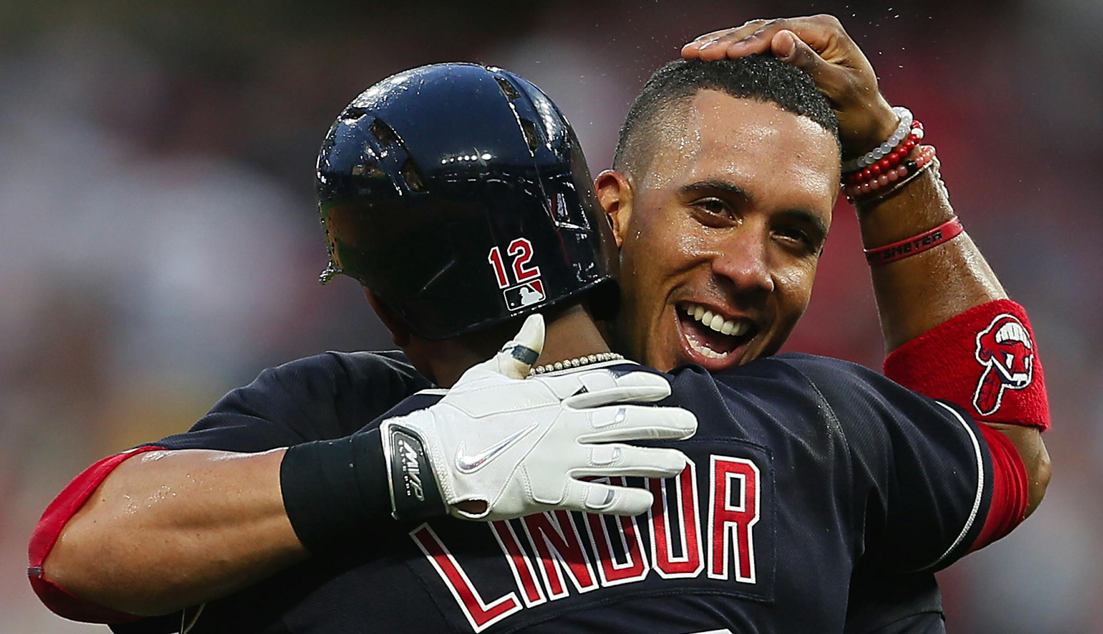 The Cleveland Indians' Francisco Lindor hugs teammate Michael Brantley after Brantley hit a double to score Lindor for a 2-1 win in 10 innings against the Chicago White Sox on Tuesday, April 11, 2017, at Progressive Field in Cleveland. (Leah Klafczynski/Akron Beacon Journal/TNS)