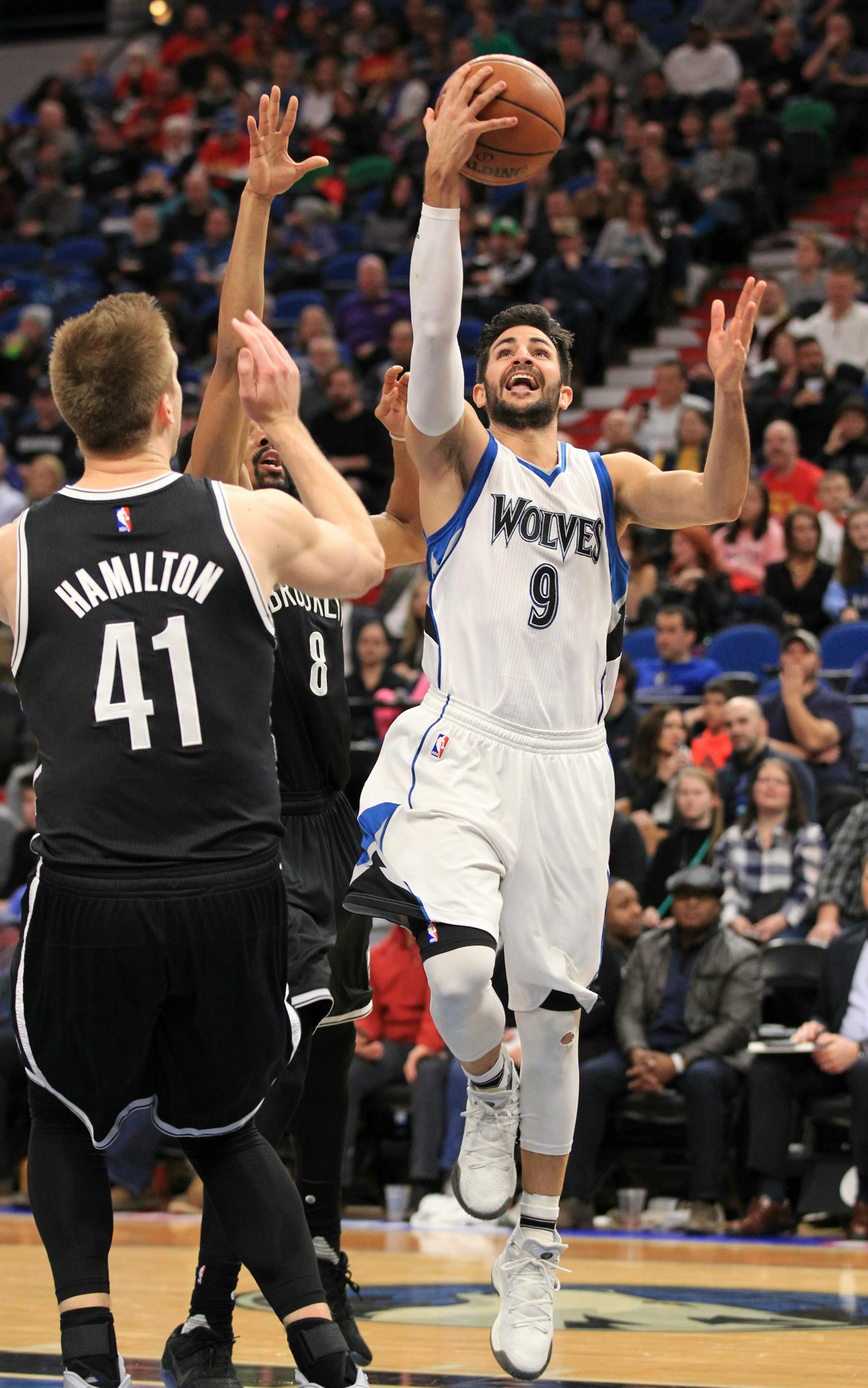 Minnesota Timberwolves guard Ricky Rubio (9) shoots in front of Brooklyn Nets forward Justin Hamilton (41) during the third quarter of an NBA basketball game in Minneapolis, Saturday, Jan. 28, 2017. The Timberwolves defeated the Nets 129-109. (AP Photo/Andy Clayton-King)