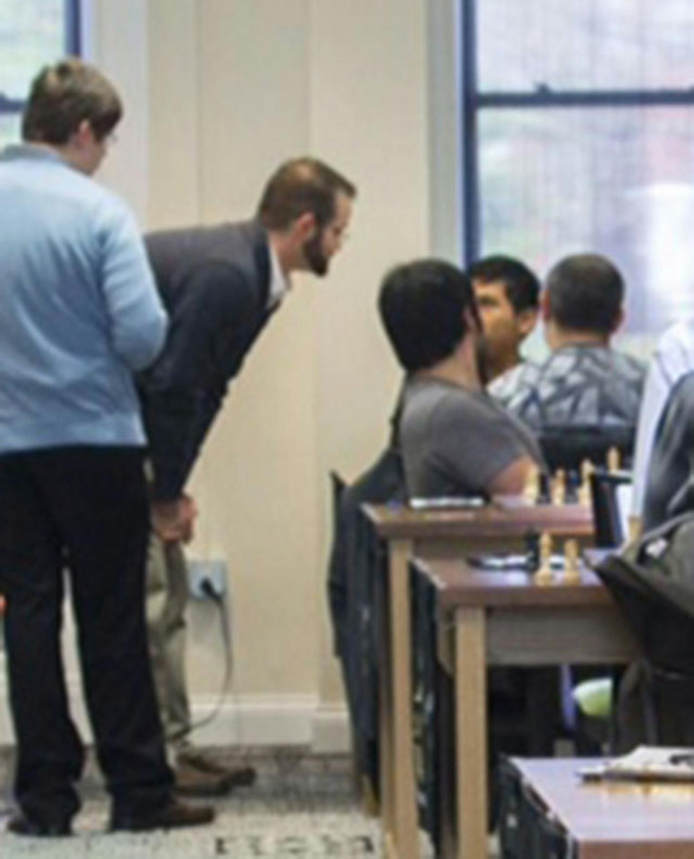 Official Tony Rich makes the ruling in Wesley So's game Friday while other players look on.