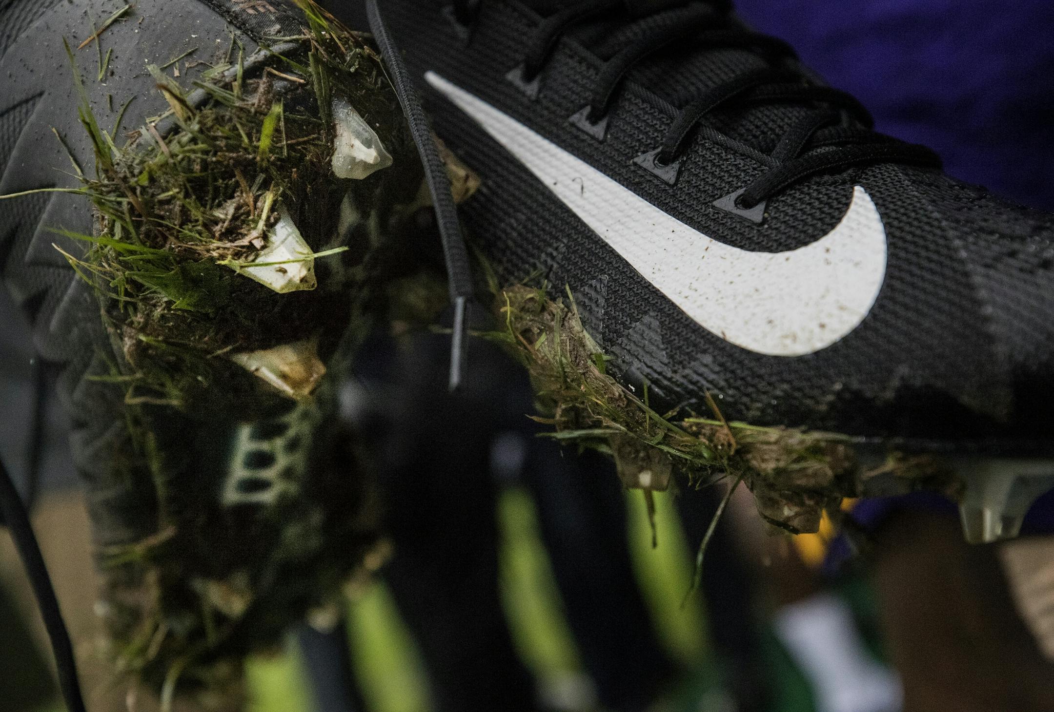 Minnesota Vikings running back Latavius Murray held his muddy cleats after changing shoes at the end of practice at Syon House outside of London in preparation for a game vs. the Cleveland Browns.