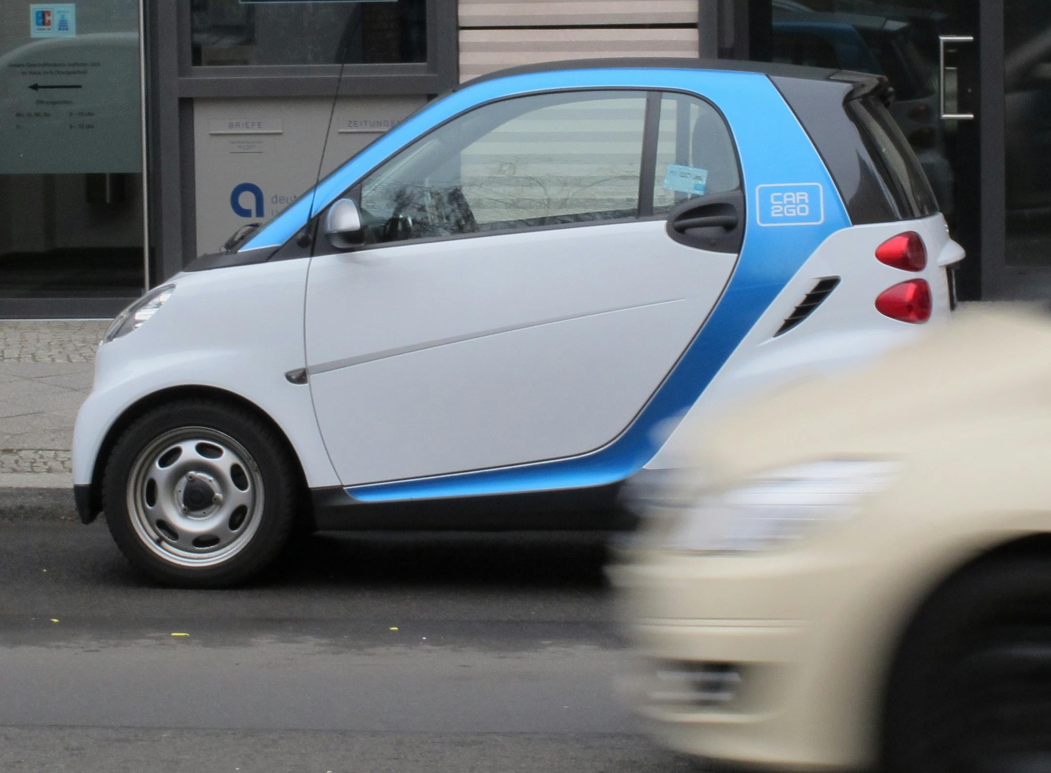 A Car2Go vehicle is parked on a street in central Berlin on Wednesday, Feb. 19, 2014. The service, operated by Mercedes-Benz and Smart car manufacturer Daimler launched a new intercity service recently.