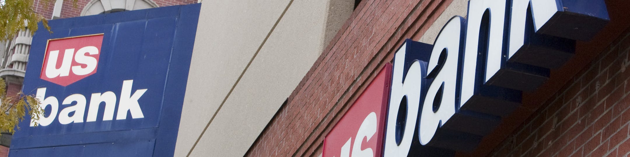 FILE - In this Oct. 20, 2009 file photo, signs on a US Bank branch in Omaha, Neb. are shown Tuesday, Oct. 20, 2009. U.S. Bancorp said Wednesday, Jan. 20, 2010, its fourth-quarter profit more than doubled from a year ago, as mortgage banking revenue grew.(AP Photo/Nati Harnik, File) ORG XMIT: NYBZ120