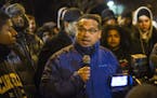 At the 4th Precinct in North Minneapolis, Congressman Keith Ellison encouraged protesters, who demanded answers over the death of Jamar Clark, to rema