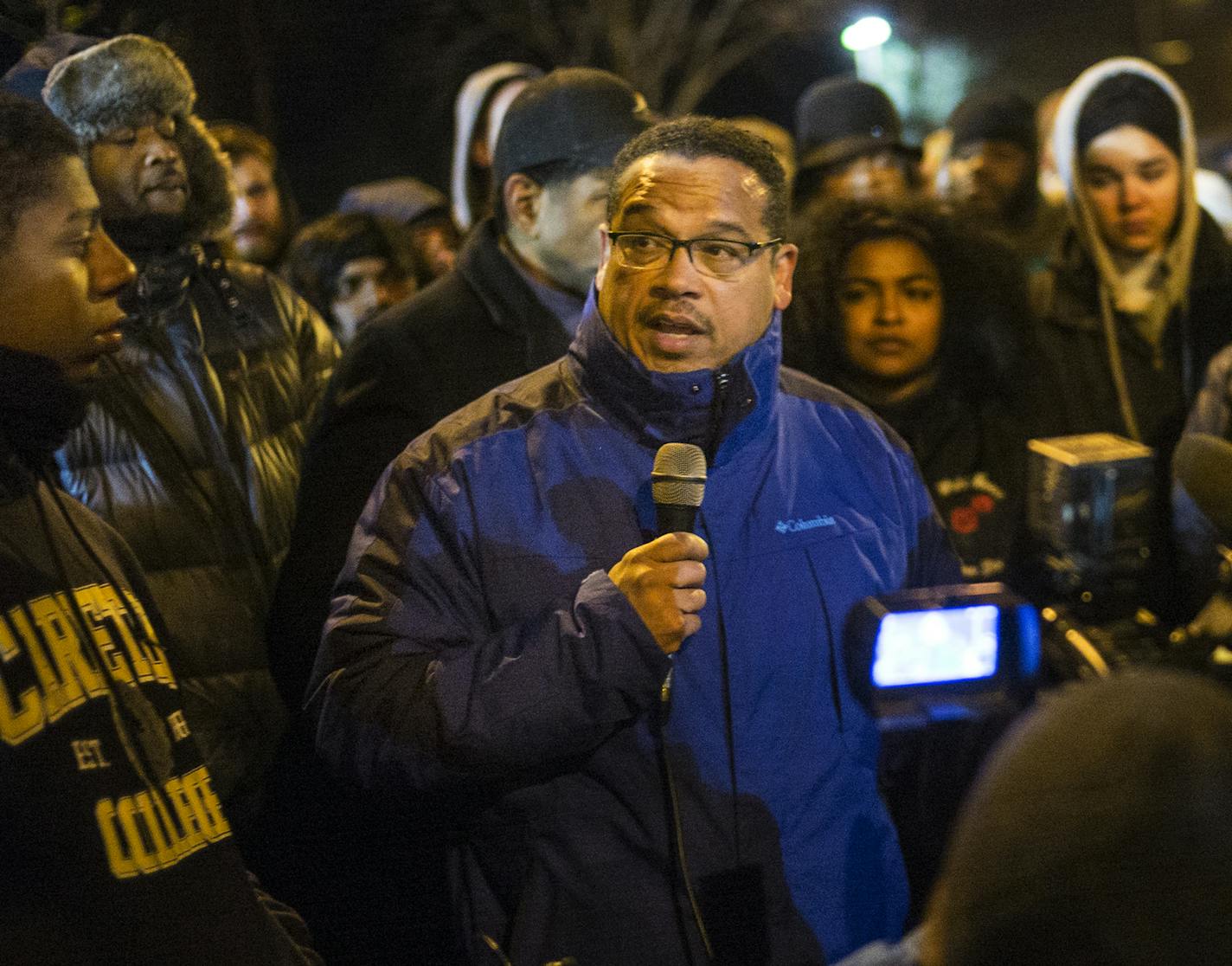 At the 4th Precinct in North Minneapolis, Congressman Keith Ellison encouraged protesters, who demanded answers over the death of Jamar Clark, to remain peaceful Thursday, Nov. 19, 2015. (Richard Tsong-Taatarii/Star Tribune via AP) ORG XMIT: MIN2015111921502697 ORG XMIT: MIN1511271948371174