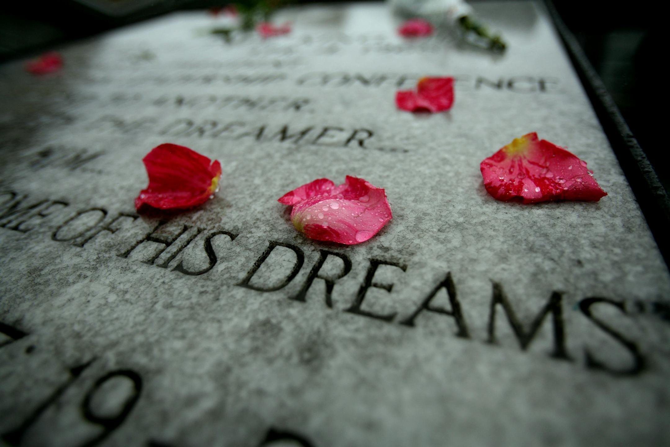 File photo: Rain soaked rose petals laid on plaque at the Lorraine Hotel in Memphis where Martin Luther King was assassinated.