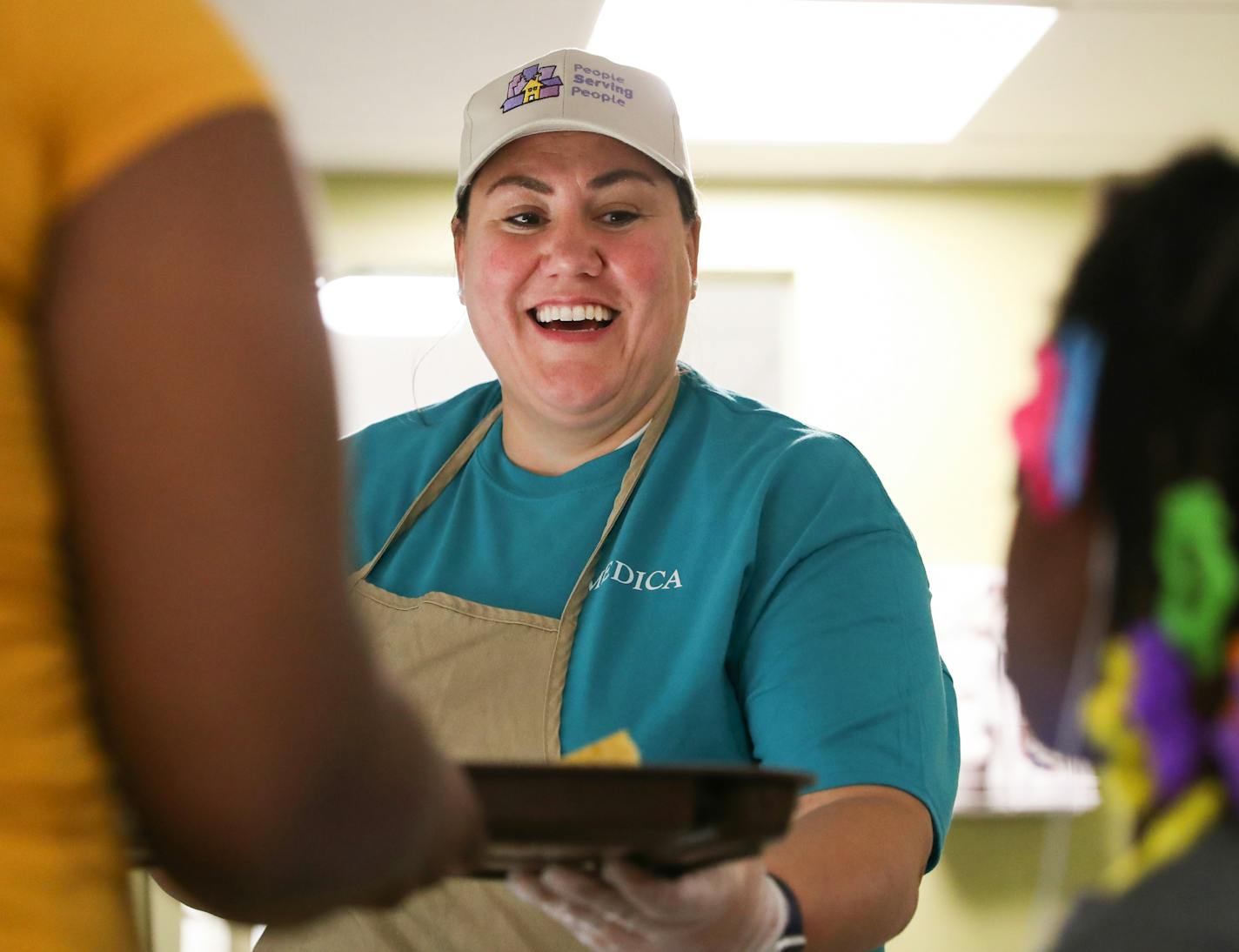 Natasha Farhat celebrated her fifth year anniversary as a volunteer at People Serving People on Thursday, April 4, 2019. ] Shari L. Gross &#x2022; shari.gross@startribune.com Medica employee Natasha Farhat will be serving dinner tonight at People Serving People thanks to the fact she can use VTO (volunteer paid time off). Medica gives its employees 16 hours of PTO a year specifically to use toward volunteering. Workplaces across Minnesota do volunteer events, but some corporations are taking it