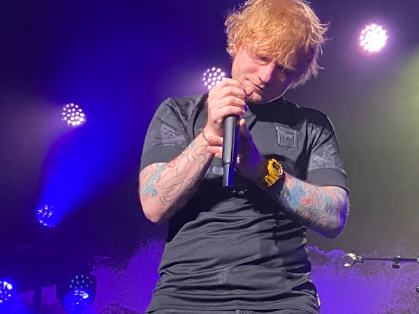 Ed Sheeran in a pensive moment in his intimate performance at the State Theatre Friday before he entertains at U.S. Bank Stadium on Saturday.