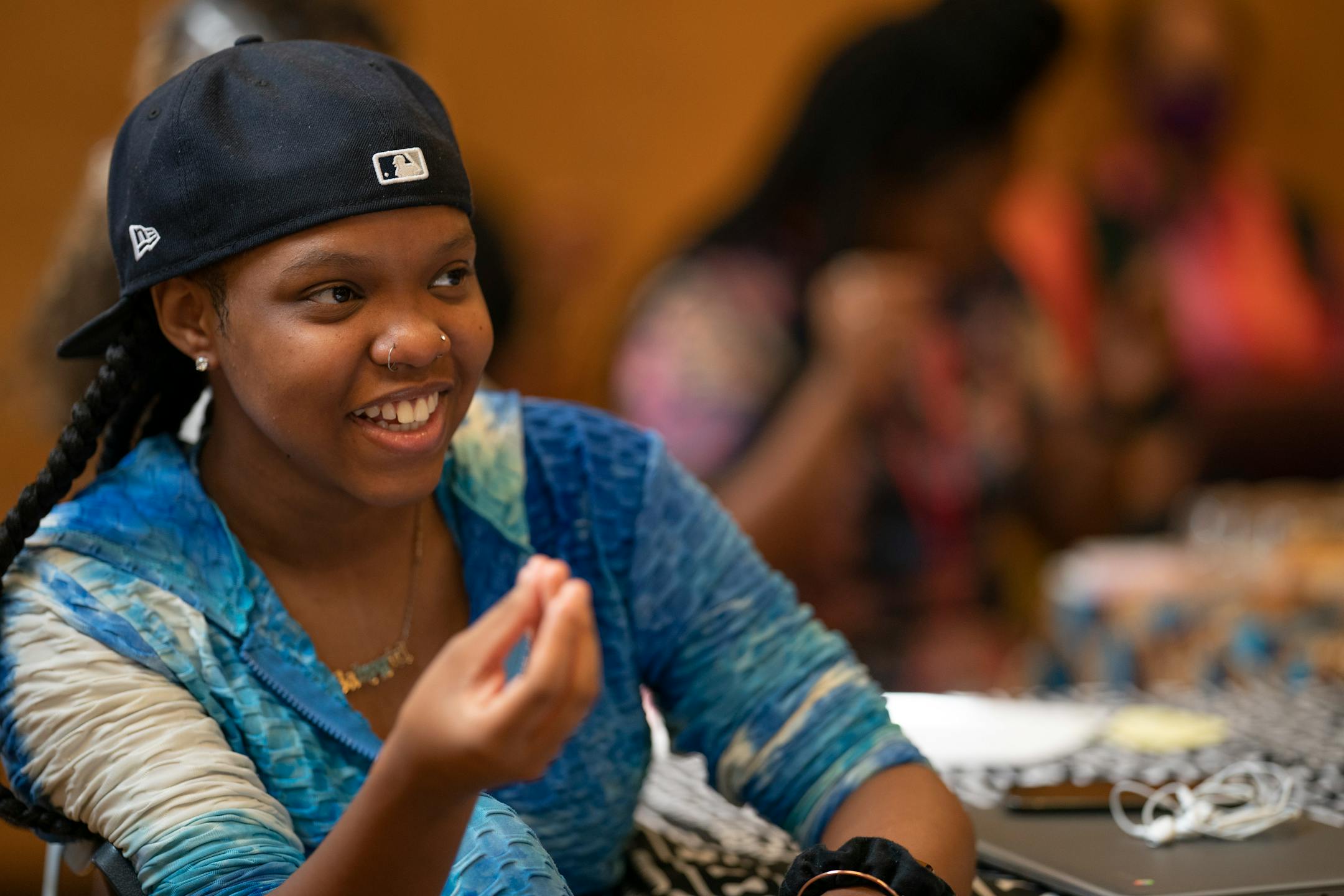 Sanaa Wilder a summer school student at Edison High listened as Vusumuzi Zulu a Black Storyteller spoke .