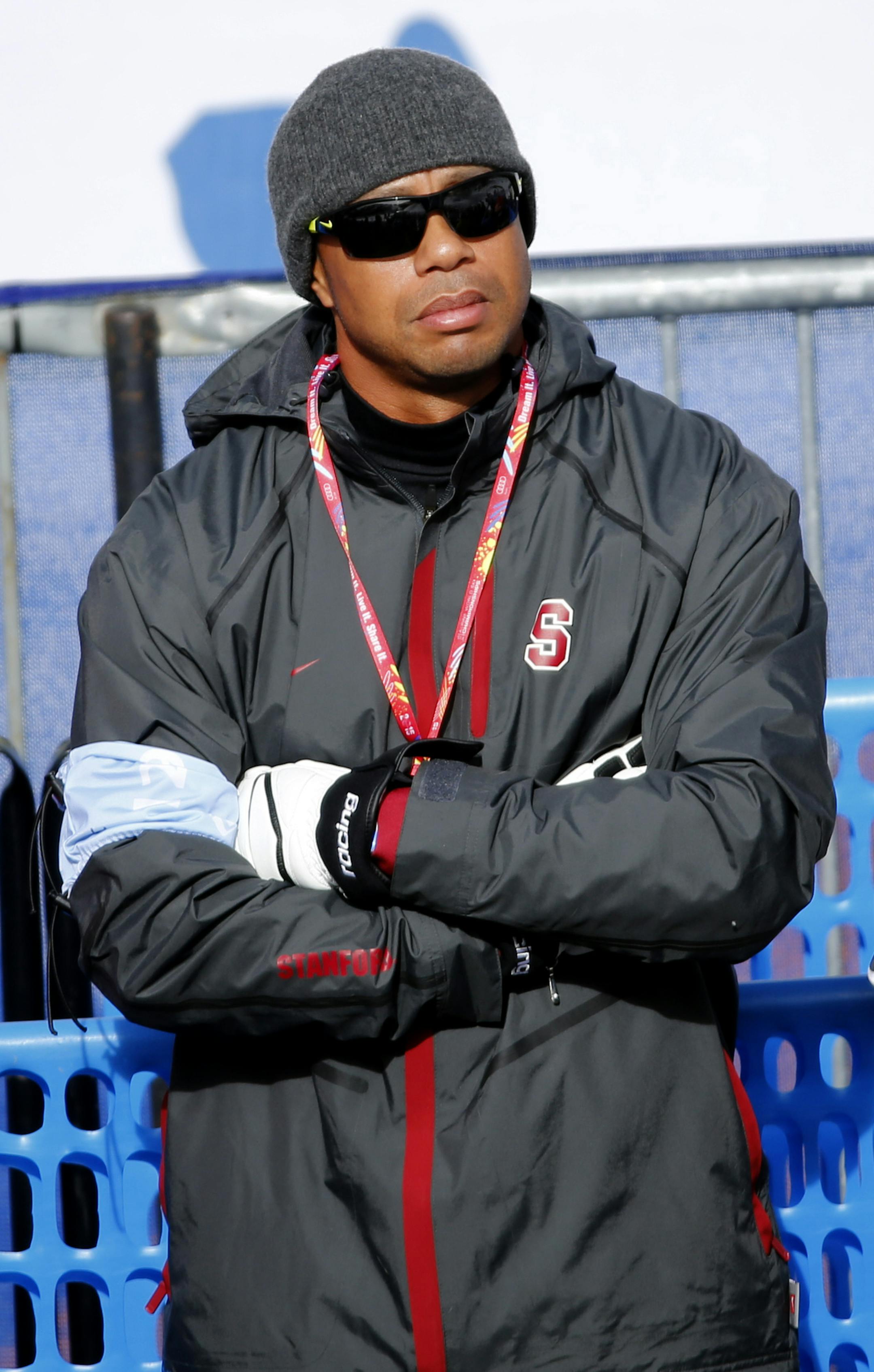 Tiger Woods watches United States' Lindsey Vonn race during the womenís giant slalom competition at the alpine skiing world championships on Thursday, Feb. 12, 2015, in Beaver Creek, Colo. (AP Photo/Marco Trovati)