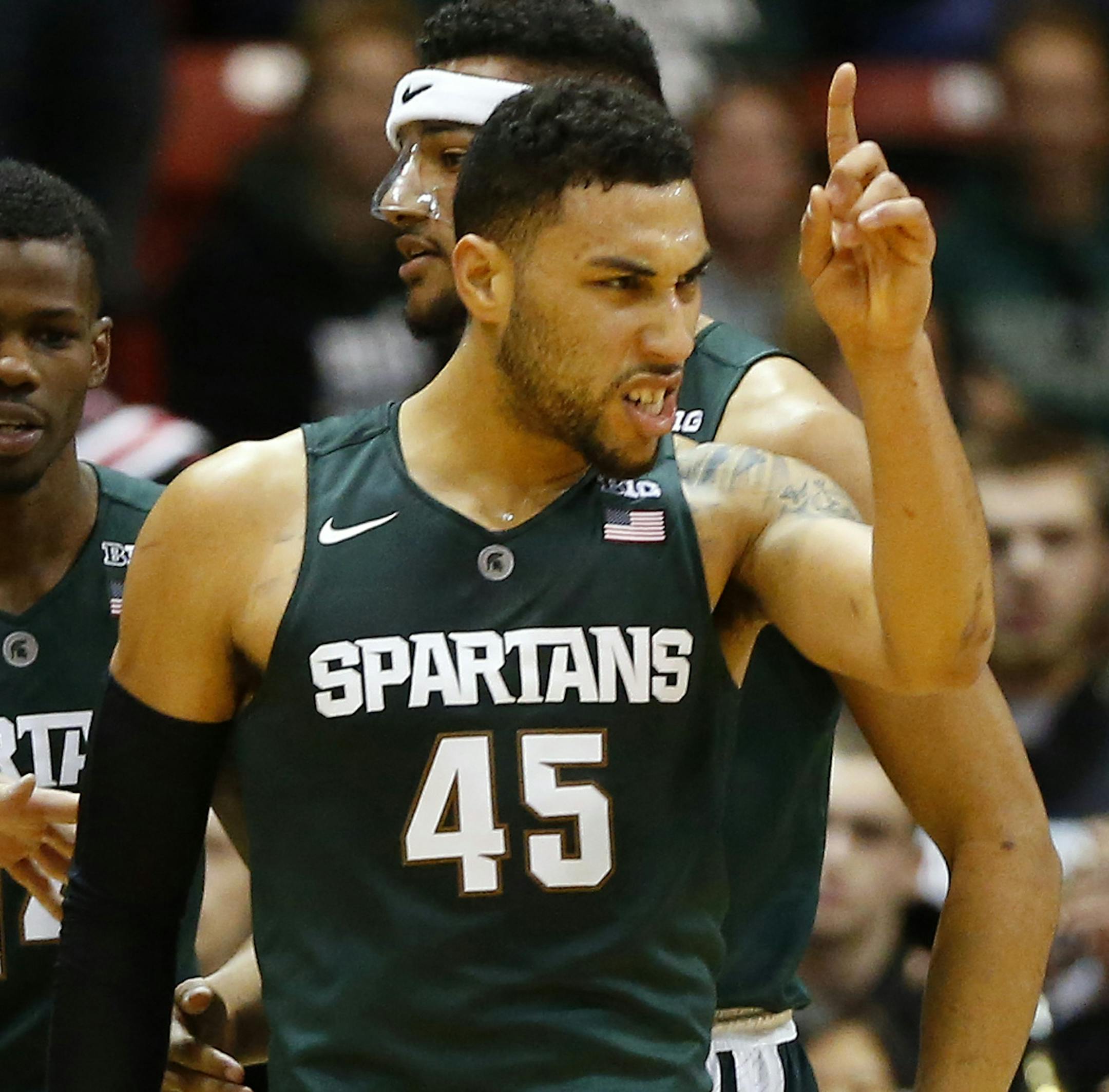 Michigan State's Denzel Valentine reacts after sinking a basket against Northeastern during the second half of a NCAA college basketball game in Boston Saturday, Dec. 19, 2015. (AP Photo/Winslow Townson) ORG XMIT: MAWT108