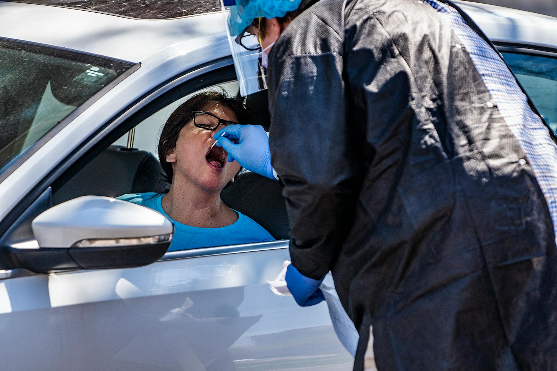 Patients, including Alma Lopez, lined up to get tested for Covid-19 at the People's Center Clinics & Services.