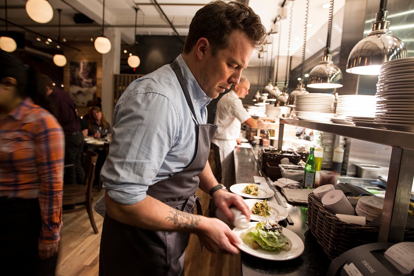 Executive chef and owner Isaac Becker keeps plate aesthetics tight at Burch Steakhouse and Pizza Bar December 13, 2013. (Courtney Perry/Special to the Star Tribune)