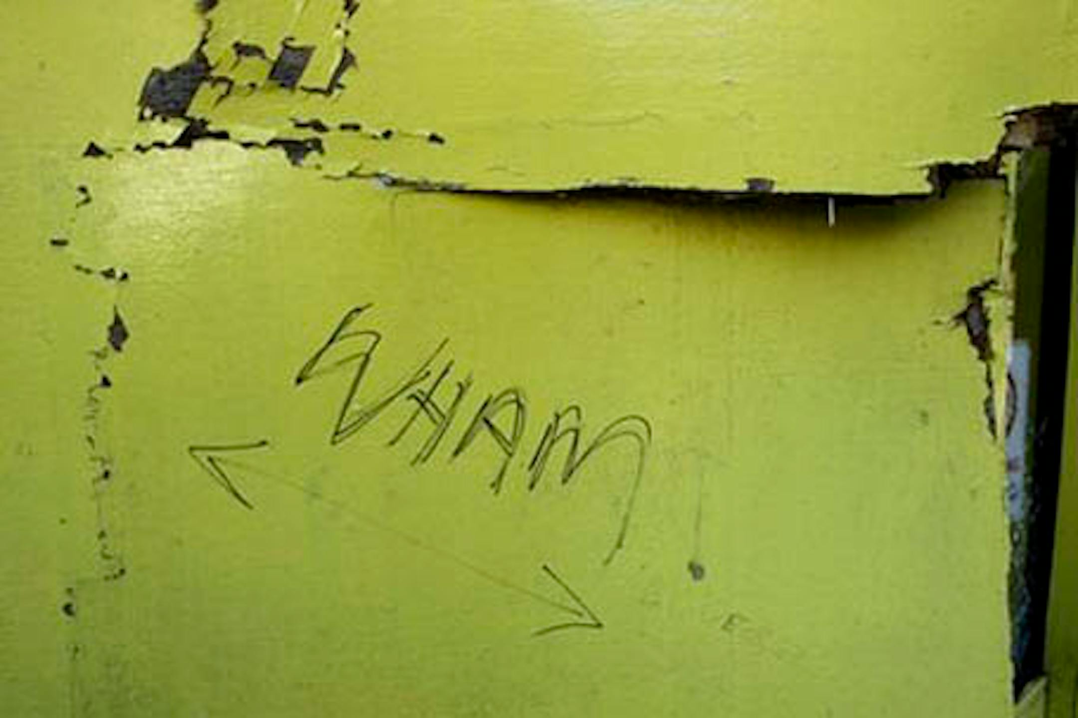 Damage is seen to wooden panelling on the facade of a branch of the photographic store Snappy Snaps in the Hampstead area of London, following allegations that it was driven into by singer George Michael, Tuesday, Aug. 24, 2010. Michael is due to appear in court on Tuesday charged with driving under the influence of drugs following the incident in the early hours of Sunday July 4. The words "Wham" and "! By George" have since been written on the paneling. "Wham!" is the name of the pop duo that led to Michael's rise to fame as a singer in the 1980s. (AP Photo/Matt Dunham)