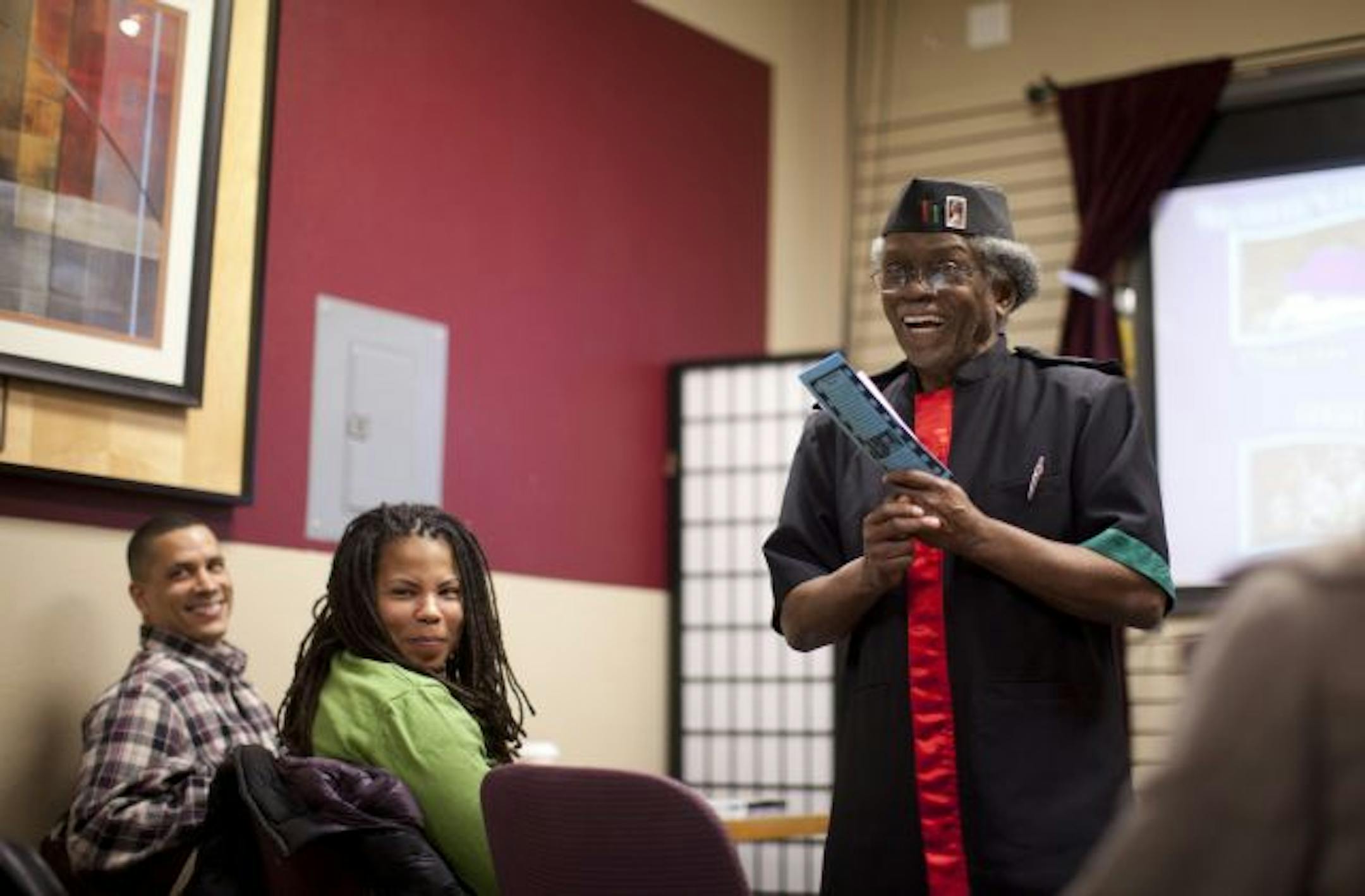 Mahmoud El-Kati introduces the festival's first film at the Golden Thyme Coffee Cafe in St. Paul.