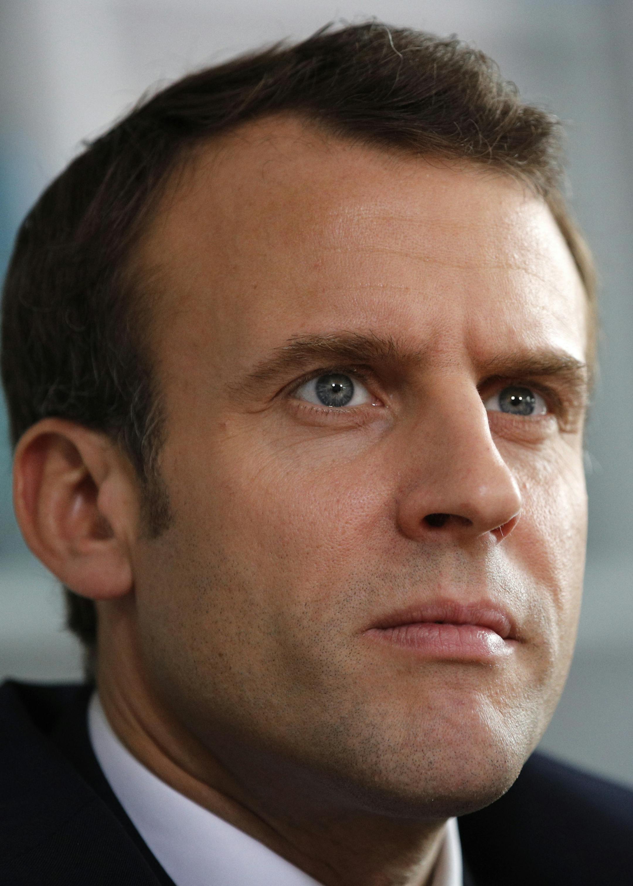 French President Emmanuel Macron listens to hospital staff during a visit at the Rouen hospital, Normandy, Thursday, April 5, 2018. Macron is unveiling a long-awaited autism plan for a country that is shockingly behind the curve on providing basic education and care for people on the autism spectrum. (AP Photo/Christophe Ena, Pool)