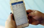 FILE - This Aug. 1, 2017, file photo, shows a call log displayed via an AT&T app on a cellphone in Orlando, Fla. New tools are coming to help fight ro