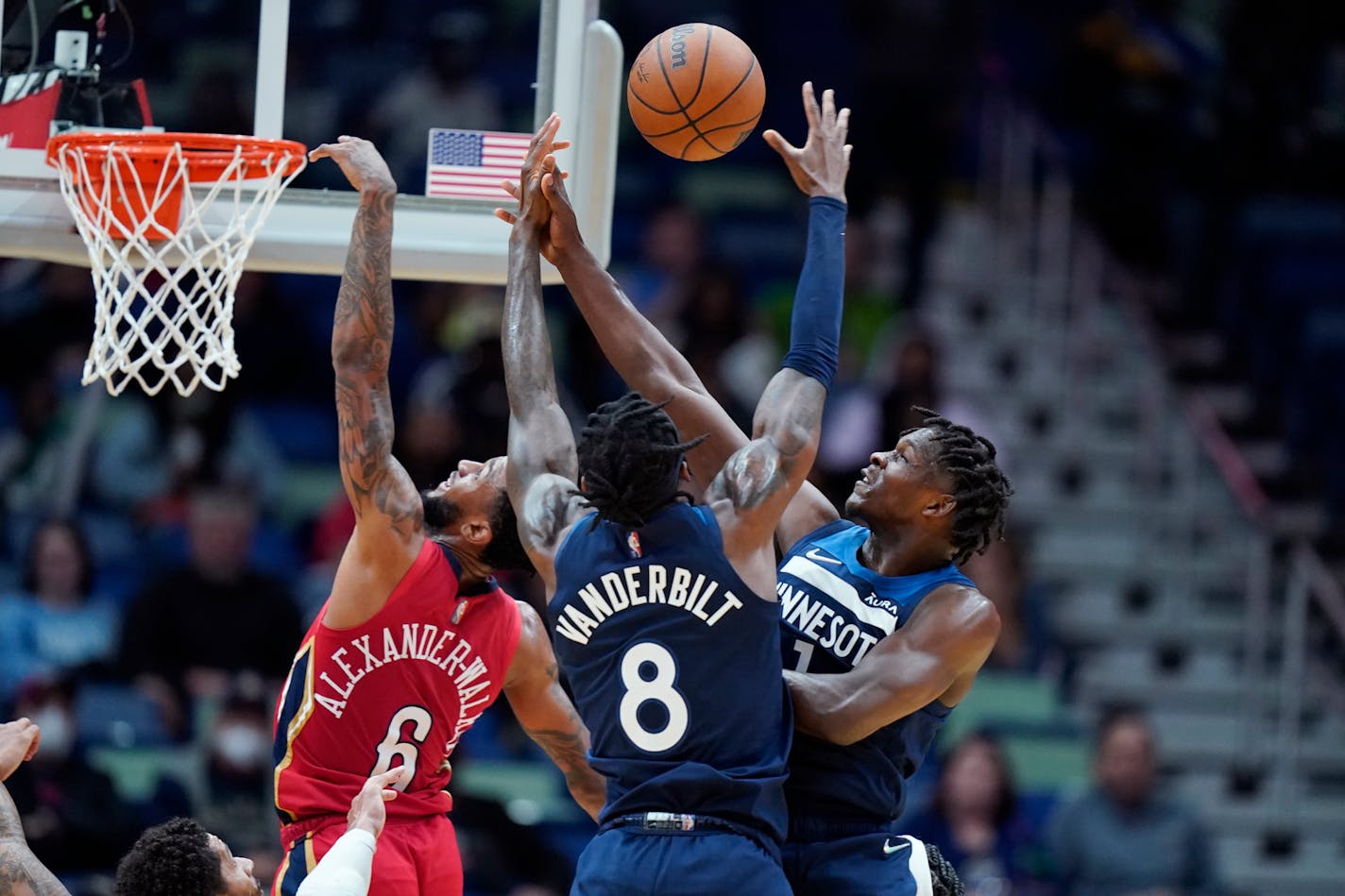 New Orleans Pelicans guard Nickeil Alexander-Walker (6) battles under the basket with Minnesota Timberwolves forward Jarred Vanderbilt (8) and forward Anthony Edwards (1) in the second half of an NBA basketball game in New Orleans, Monday, Nov. 22, 2021. The Timberwolves won 110-96.(AP Photo/Gerald Herbert)