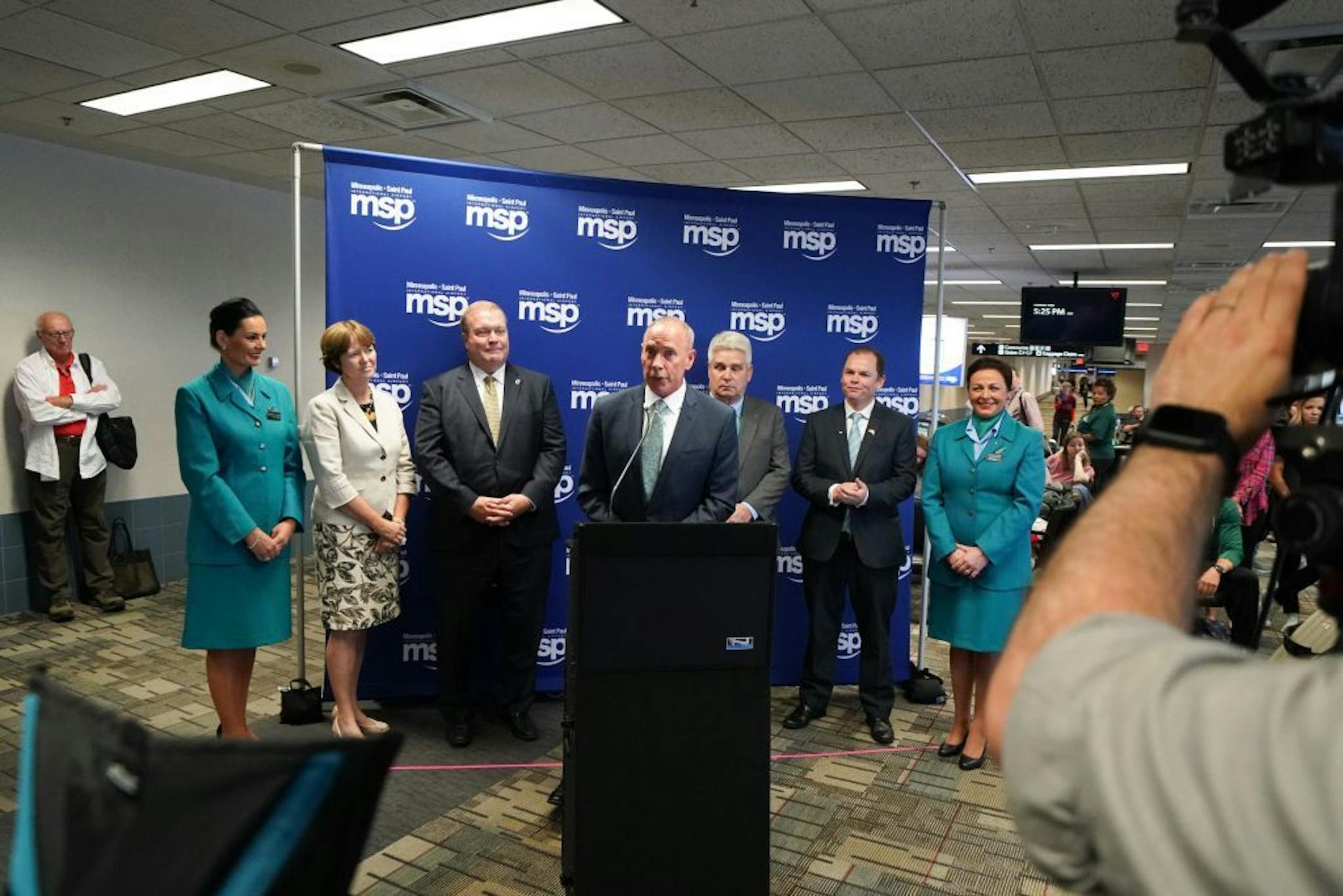 Brian Ryks, center, Executive Director and CEO of the Metropolitan Airports Commission welcomed in the first flight. The first direct Aer Lingus flight from Dublin landed at Minneapolis St. Paul International Airport. It received a water canon welcome from the Airport fire Department and the Mall of America brought SpongeBob SquarePants and handed out gift bags. Sweet Retreat Cupcake Boutique provided specially designed cupcakes and a special cake with landmarks from Minneapolis and Dublin.