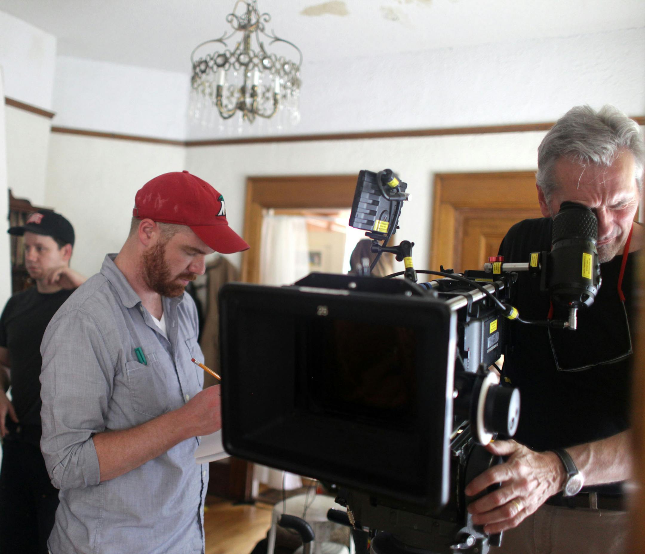 Director Greg Winter adjusts the camera during the shoot on Monday afternoon. A group of homeless Twin Cities kids began shooting for their screenplay they've been working on since February. ] Professional film crews are helping direct and produce the project. MONICA HERNDON monica.herndon@startribune.com St. Paul, MN 06/16/2014