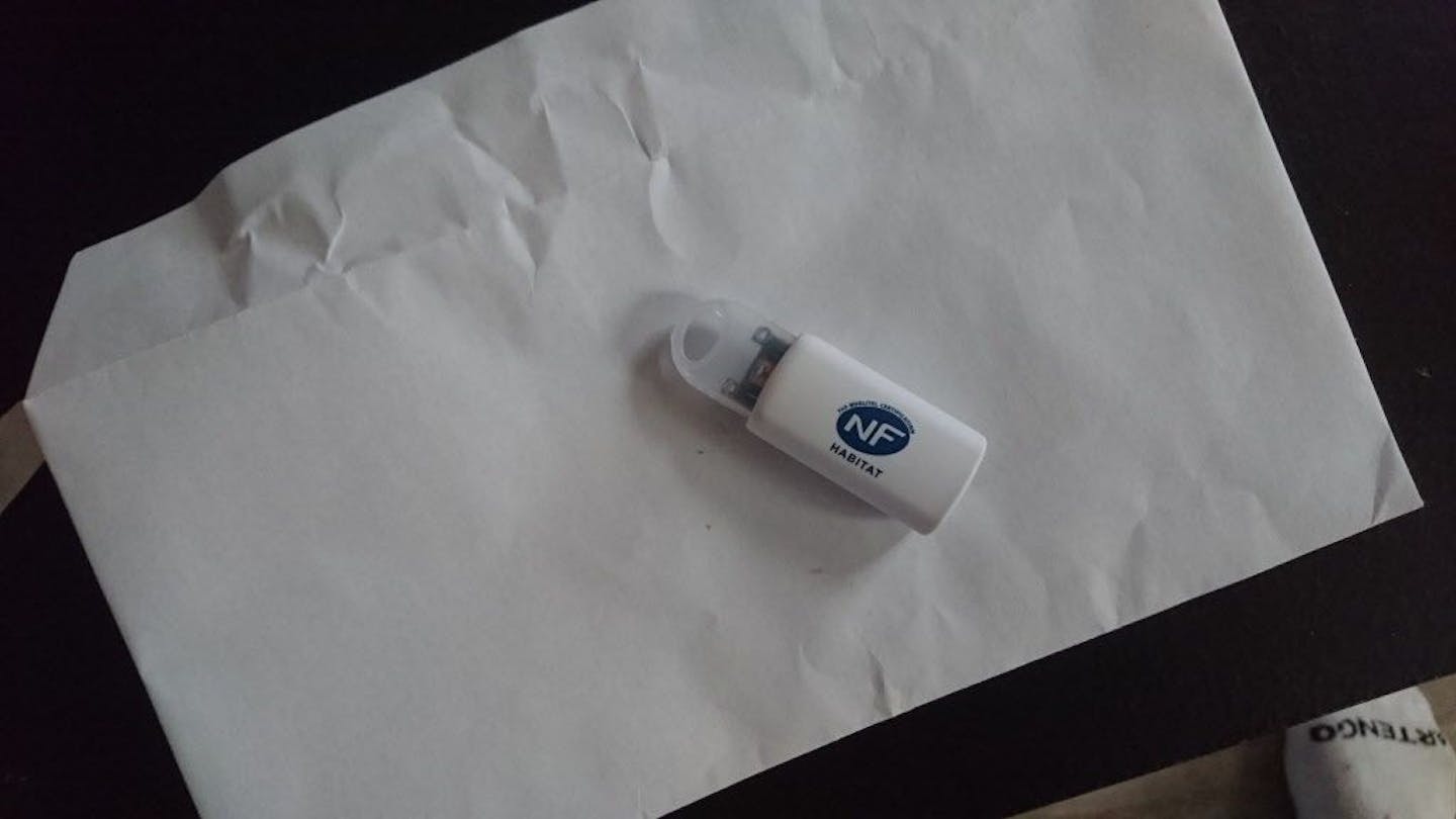 This photo taken July 9, 2016 shows a thumb drive delivered to the home of French software engineer Julien Ascoet outside the French port city of Nantes. Although the memory stick is branded, Ascoet says he doesn't believe the brand is in any way linked to the mysterious delivery. And Ascoet is not alone; there are signs that cybercriminals are experimenting with hand-delivery of malware to people�s homes. Australian police have drawn international attention by announcing that �extremely harmful