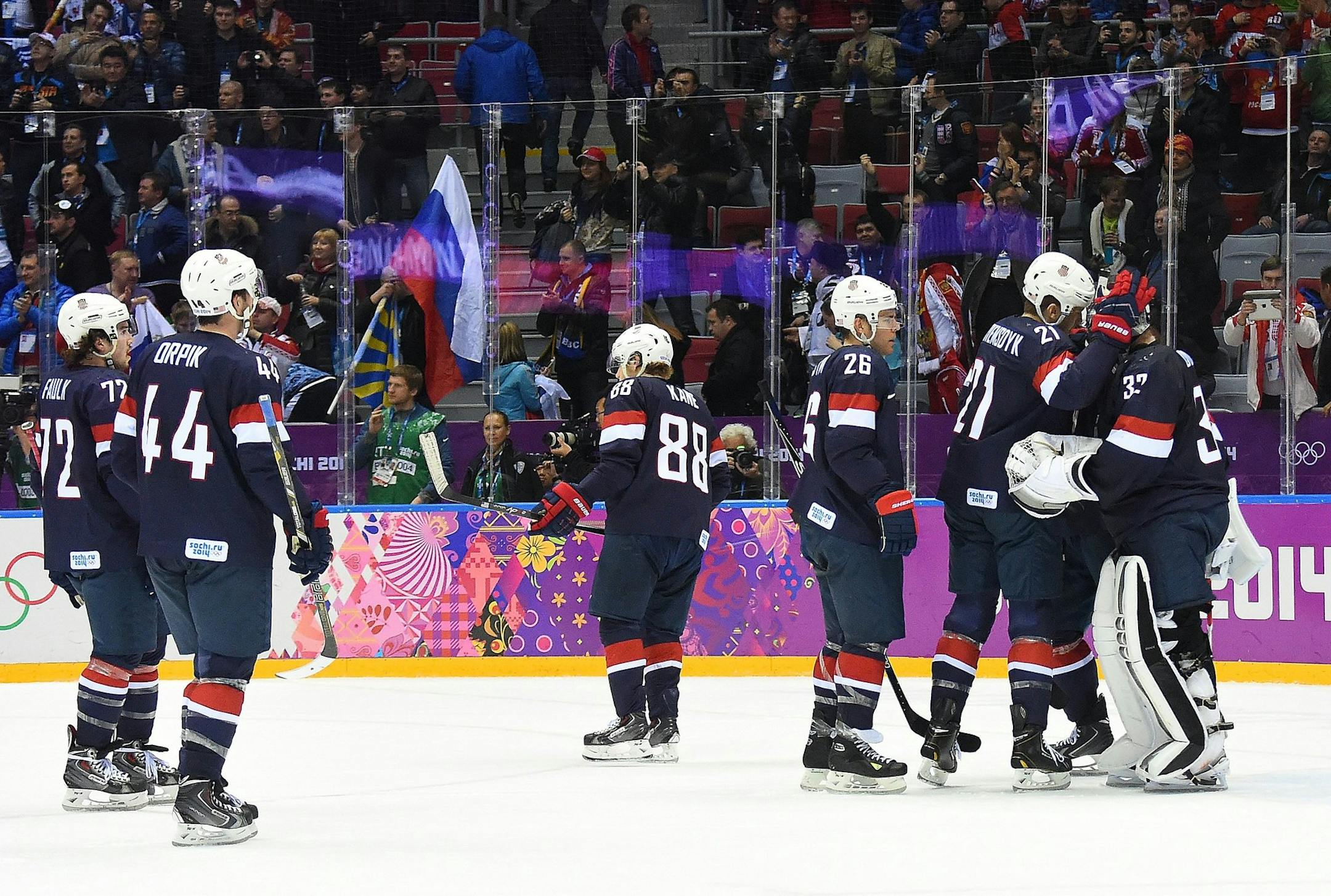 The USA Hockey team skated off the ice following their lost to Finland 5-0 in the men's bronze medal men's hockey game at the Winter Olympics on Saturday.