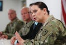 Minnesota National Guard Lt. Col. Lyndsey Olson, answers a question from a media member during a press conference about how sexual assault cases invol