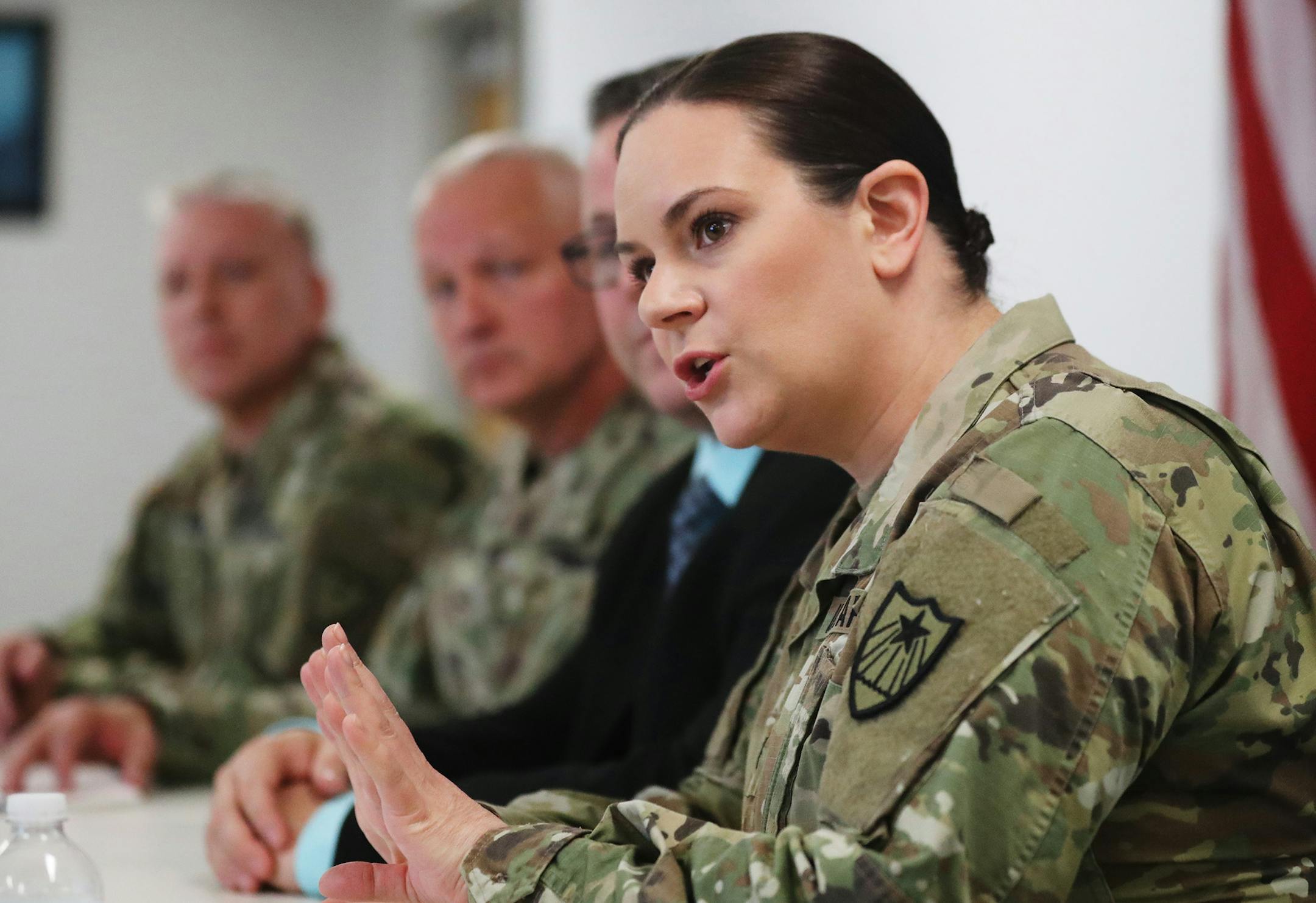 Minnesota National Guard Lt. Col. Lyndsey Olson, answers a question from a media member during a press conference about how sexual assault cases involving Guard members are being handled. Other Guard representatives included Col. Doug Simon, left to right, Maj. Gen. Jon Jensen and John Thompson, second from right, Thursday, April 25, 2019, at Ben Franklin Armory in Arden Hills, MN.] DAVID JOLES •david.joles@startribune.com Minnesota National Guard representatives, along with Congresswoman