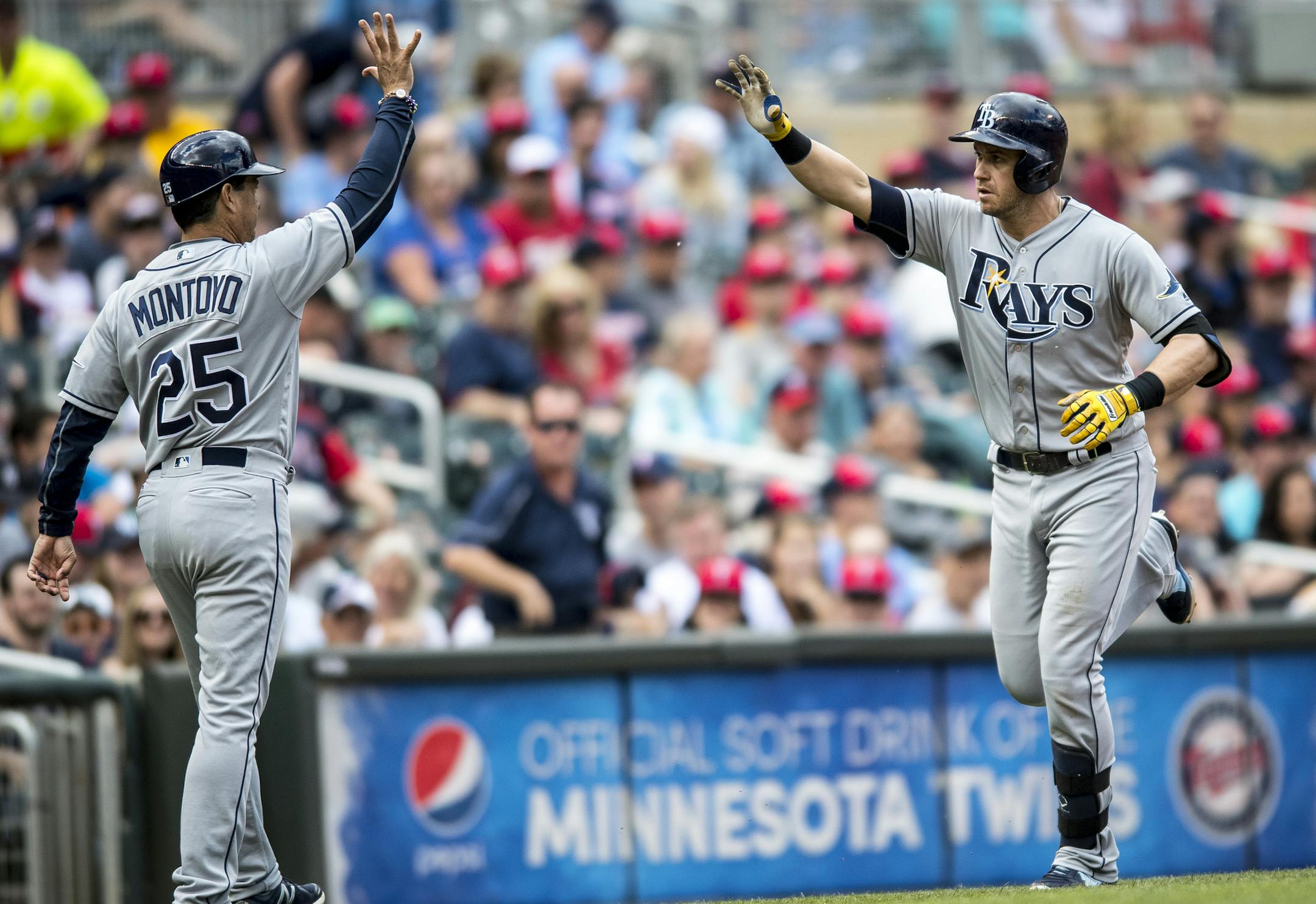 Tampa Bay Rays third baseman Evan Longoria (3) high fived third base coach Charlie Montoyo (25) after Longoria hit a solo home run in the top of the 5th inning Saturday against the Twins. ] (AARON LAVINSKY/STAR TRIBUNE) aaron.lavinsky@startribune.com The Minnesota Twins play the Tampa Bay Rays on Saturday, June 4, 2016 at Target Field in Minneapolis, Minn.