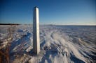 FILE - A border marker, between the United States and Canada is shown just outside of Emerson, Manitoba, on Jan. 20, 2022.
